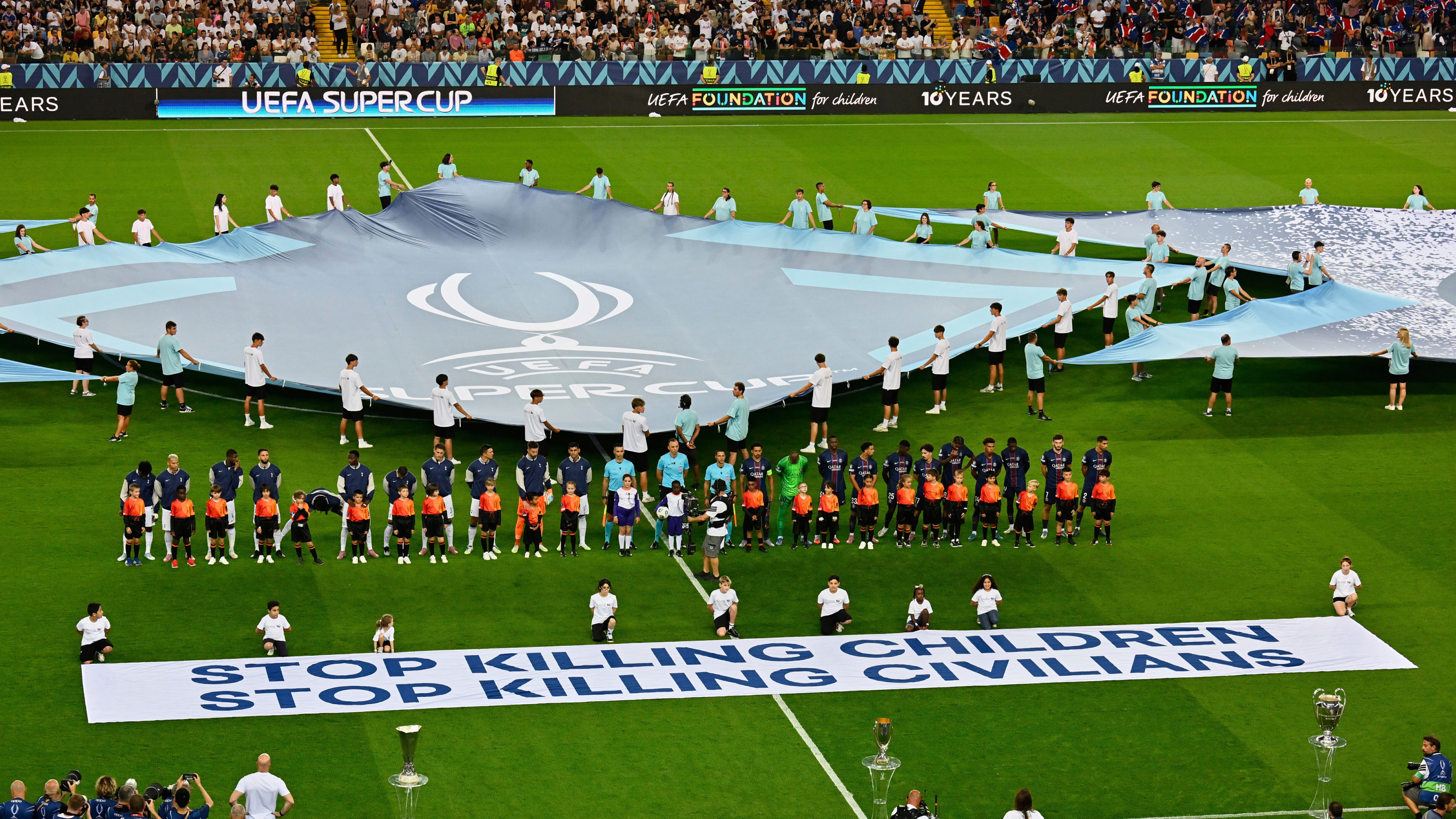 FILE - The players line up before the UEFA Super Cup soccer match between Paris Saint-Germain and Tottenham Hotspur in Udine, Italy, Wednesday, Aug. 13, 2025.