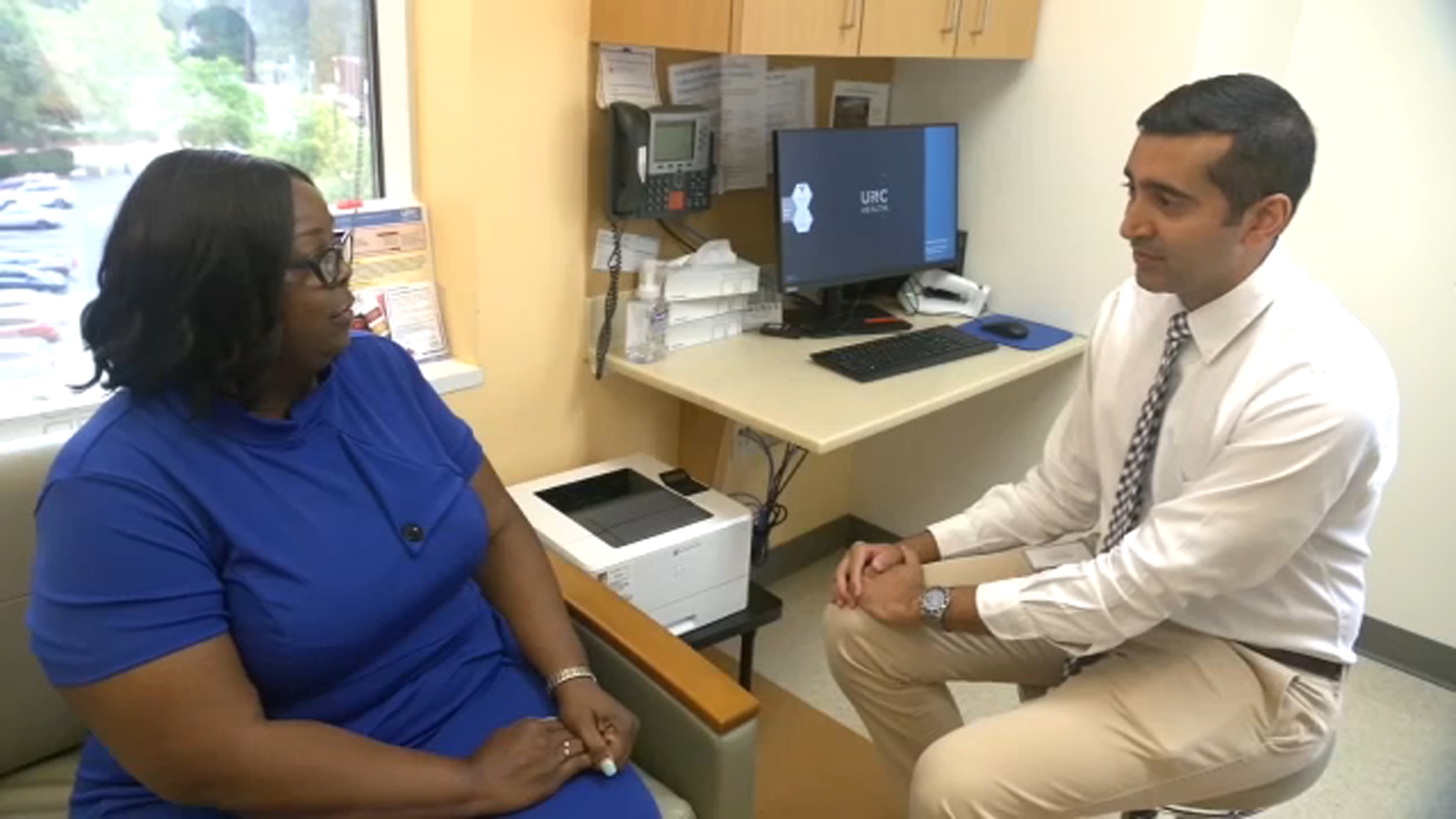 Belinda Duggins consults with Dr. Siddharth Sheth, an Associate Professor of Oncology at UNC.