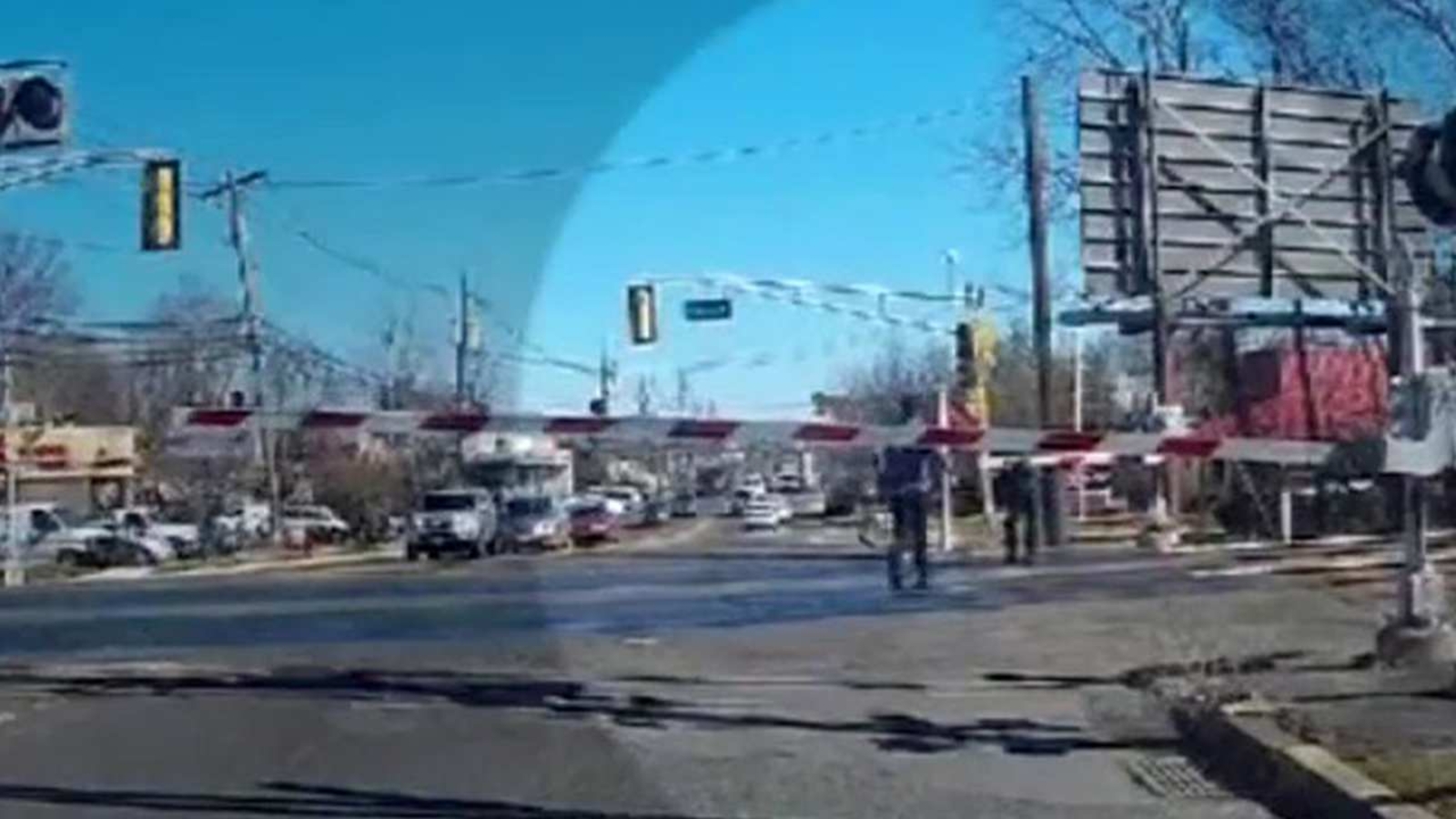 VIDEO: Driver leaps from car to save elderly woman crossing in front of ...