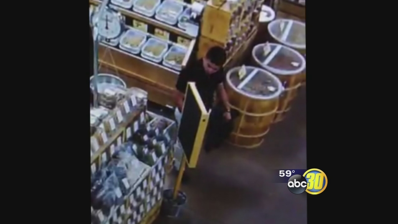 Man caught on surveillance video stealing multiple wallets at grocery store in Clovis