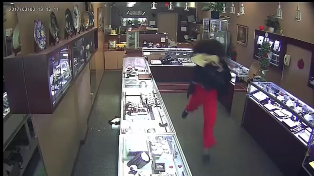 Surveillance video: Drag robbery 