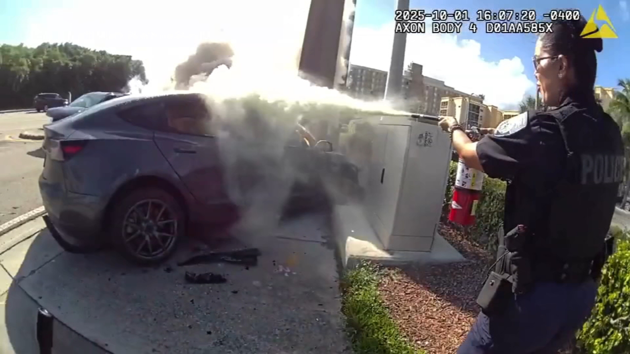 First Responders Rush to Put Out Deadly Tesla Fire in Bodycam Footage