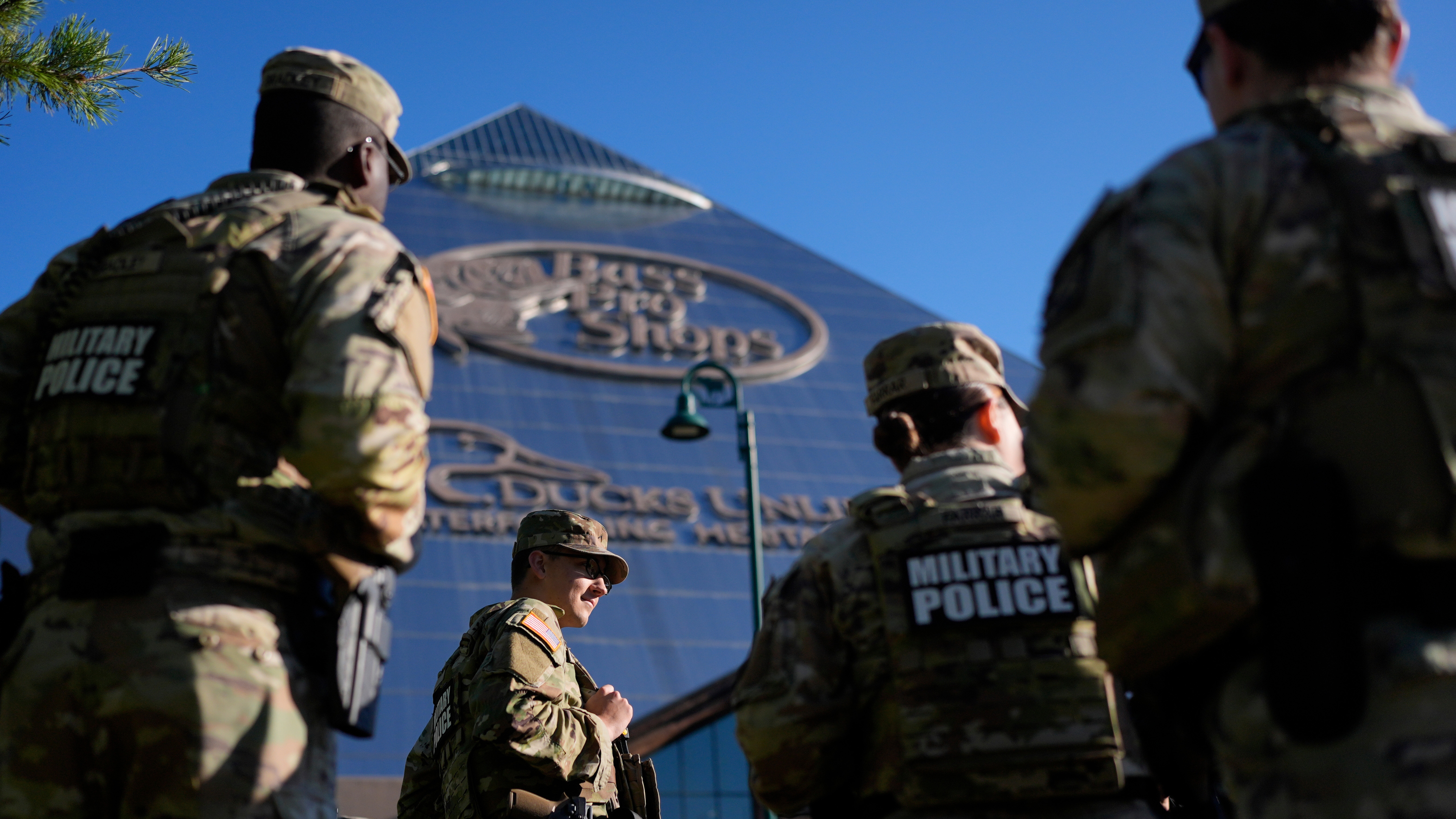 Members of National Guard patrol outside a Bass Pro Shops, Friday, Oct. 10, 2025, in Memphis, Tenn.