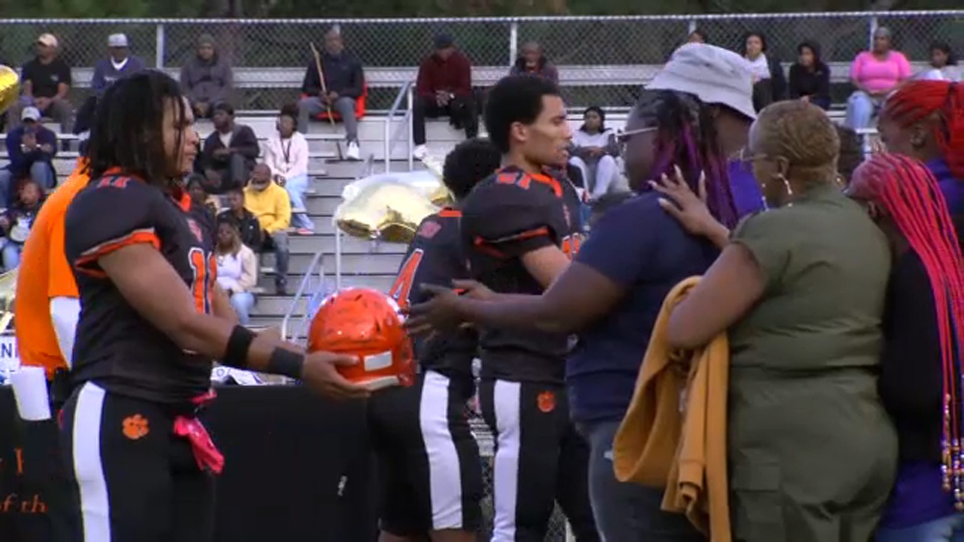 South View High School presented tokens of support, including custom football helmets.