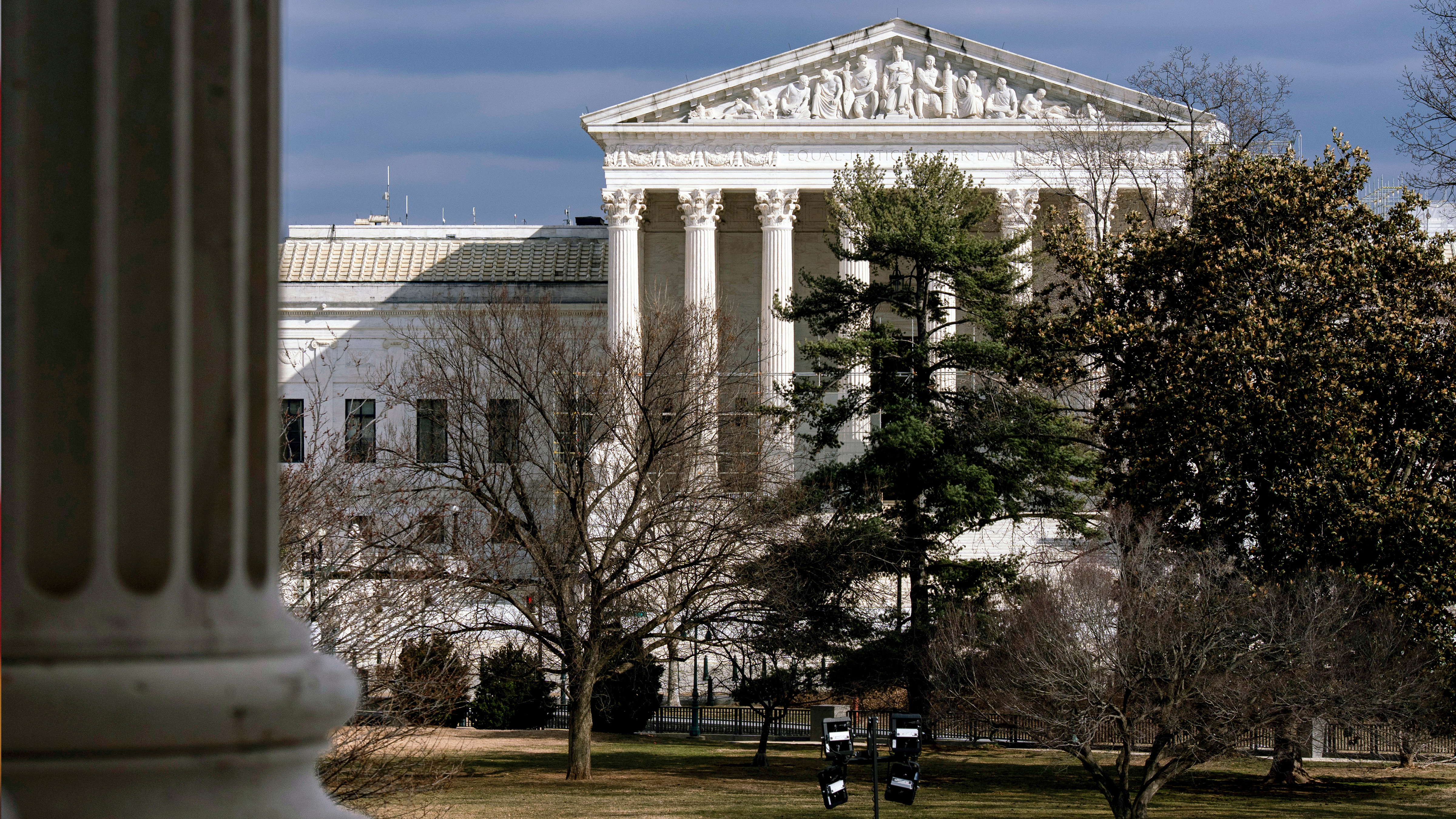 The Supreme Court is seen in the distance, framed through columns of the U.S. Senate at the Capitol in Washington, Feb. 20, 2025.