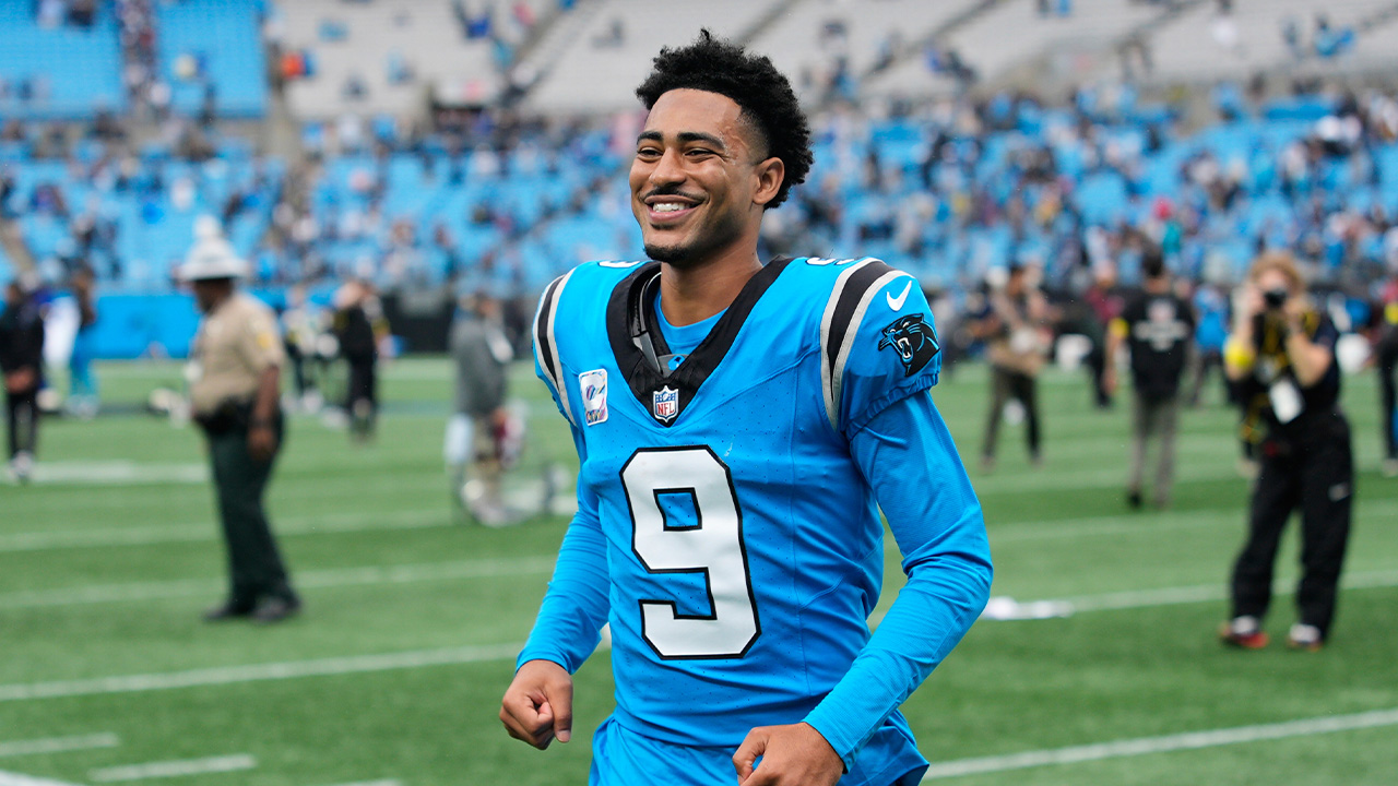 Carolina Panthers' Bryce Young (9) smiles as he jogs off the field after the team's NFL football game against the Dallas Cowboys, Sunday, Oct. 12, 2025, in Charlotte, N.C.