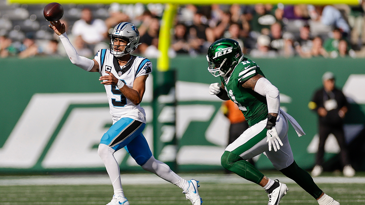 Panthers quarterback Bryce Young throws under pressure from Jets linebacker Jermaine Johnson II on Sunday in East Rutherford, N.J.