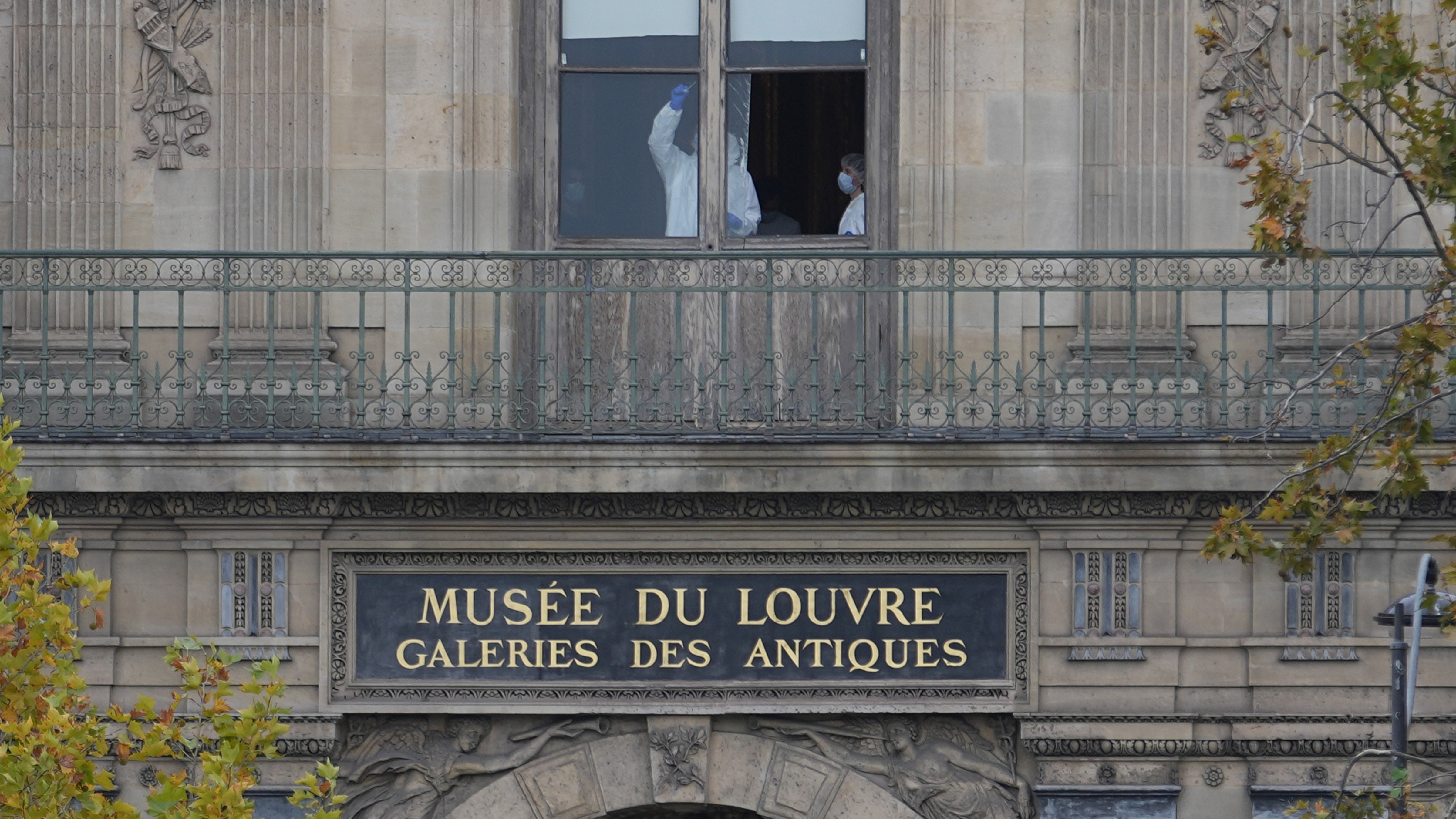 Police officers work inside the Louvre museum, Sunday, Oct. 19, 2025 in Paris.