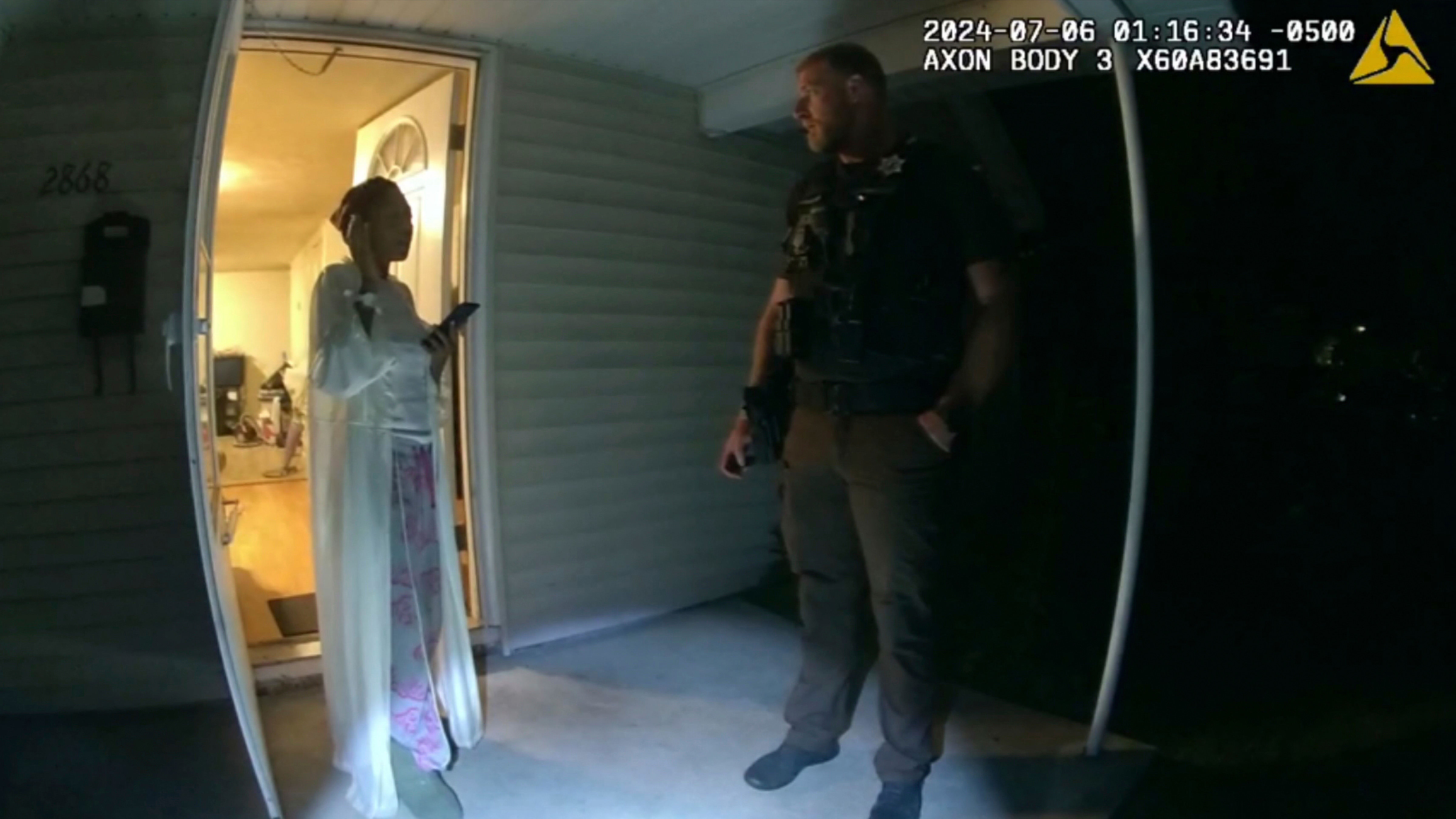 In this image taken from body camera video released by Illinois State Police, Sonya Massey, left, talks with former Sangamon County Sheriff's Deputy Sean Grayson outside her home in Springfield, Ill., July 6, 2024. 