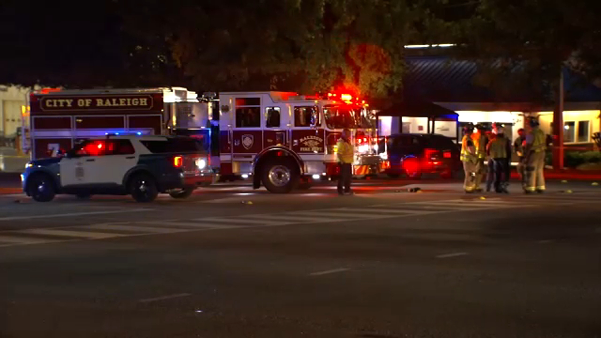Raeigh police and fire at the scene where the pedestrian was struck Tuesday night.