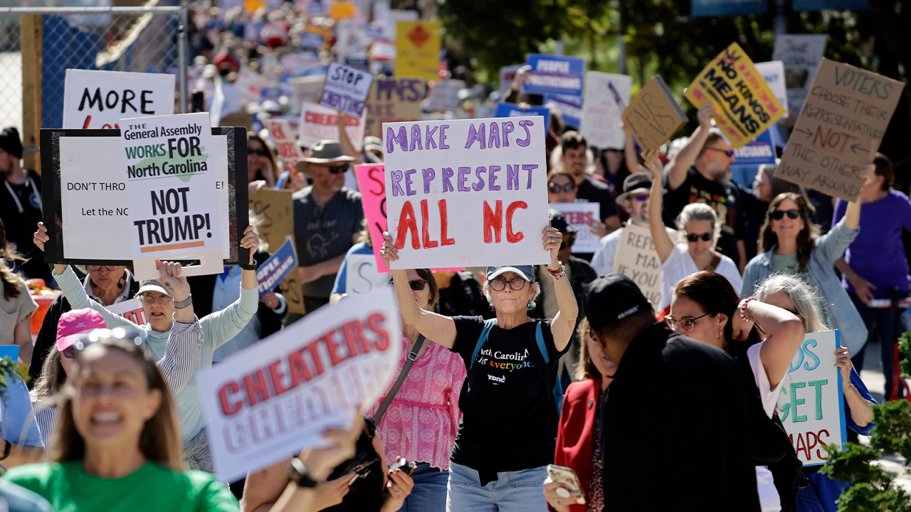 Marchers proceed from the Capitol during a rally protesting a proposed redistricting map Tuesday, Oct. 21, 2025, in Raleigh, N.C.