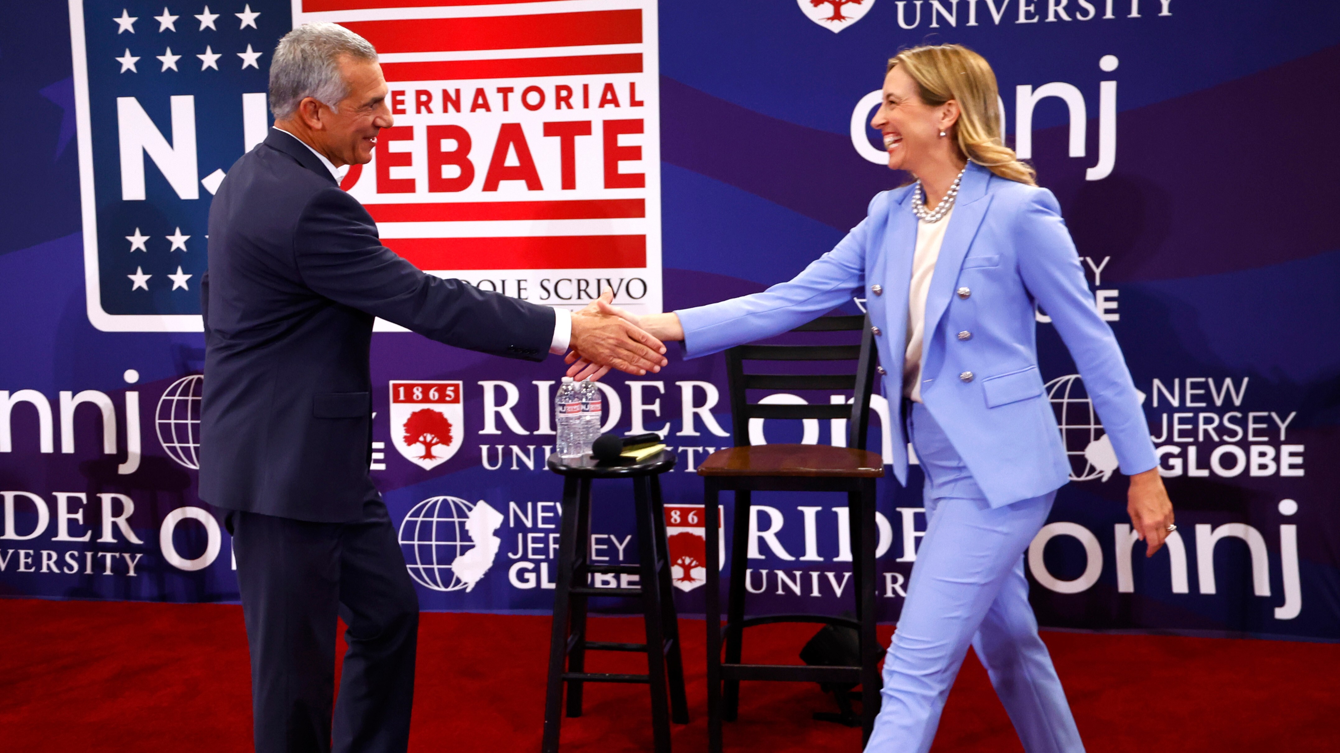 Republican candidate Jack Ciattarelli, left, shake hands with Democratic candidate for governor Mikie Sherrill, right, before a gubernatorial debate Sept. 21, 2025=