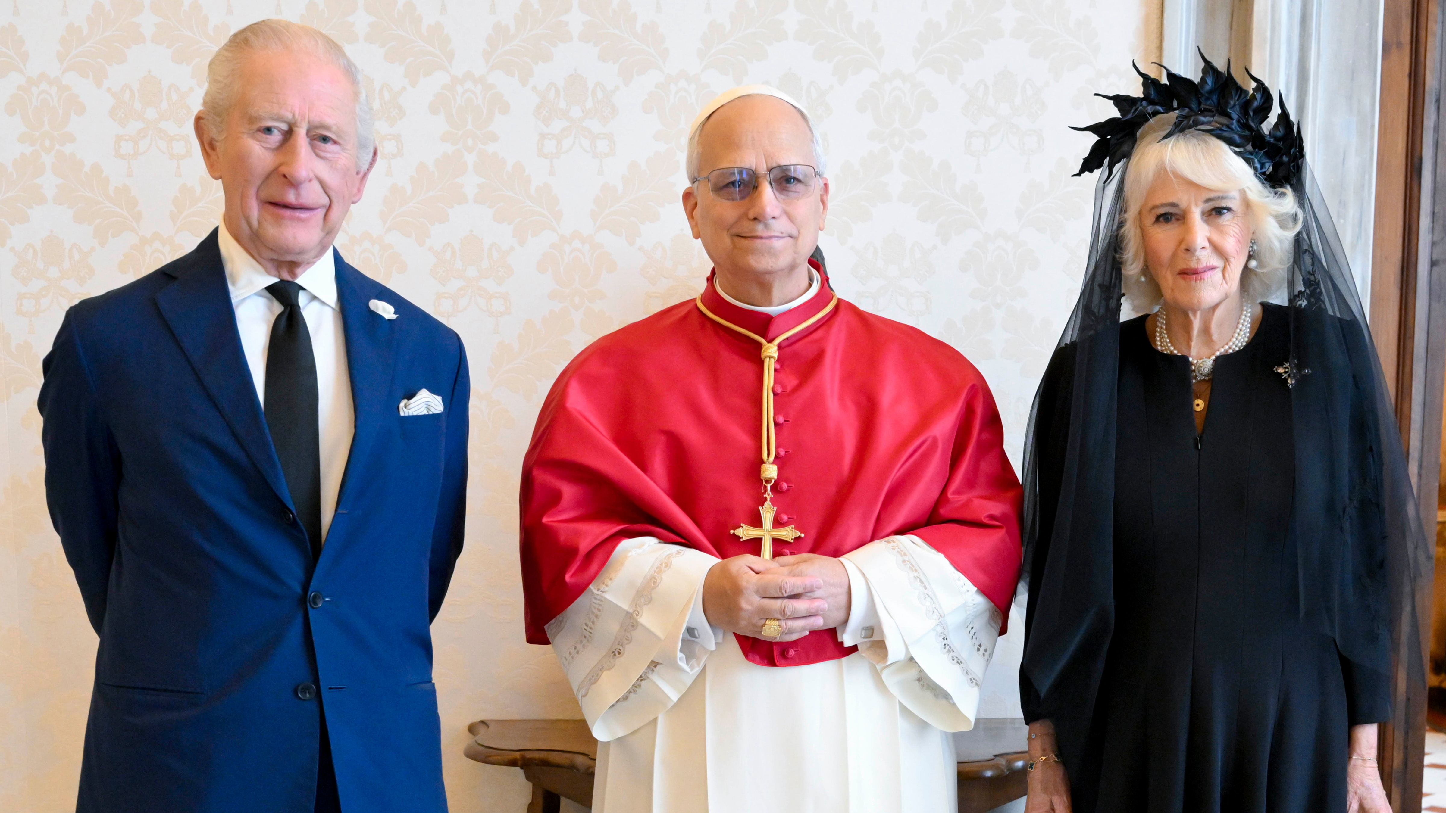 In this picture made available by Vatican Media, Britain's King Charles III and Queen Camilla pose with Pope Leo XIV as they meet at the Vatican during a state visit, Thursday, Oct. 23, 2025.