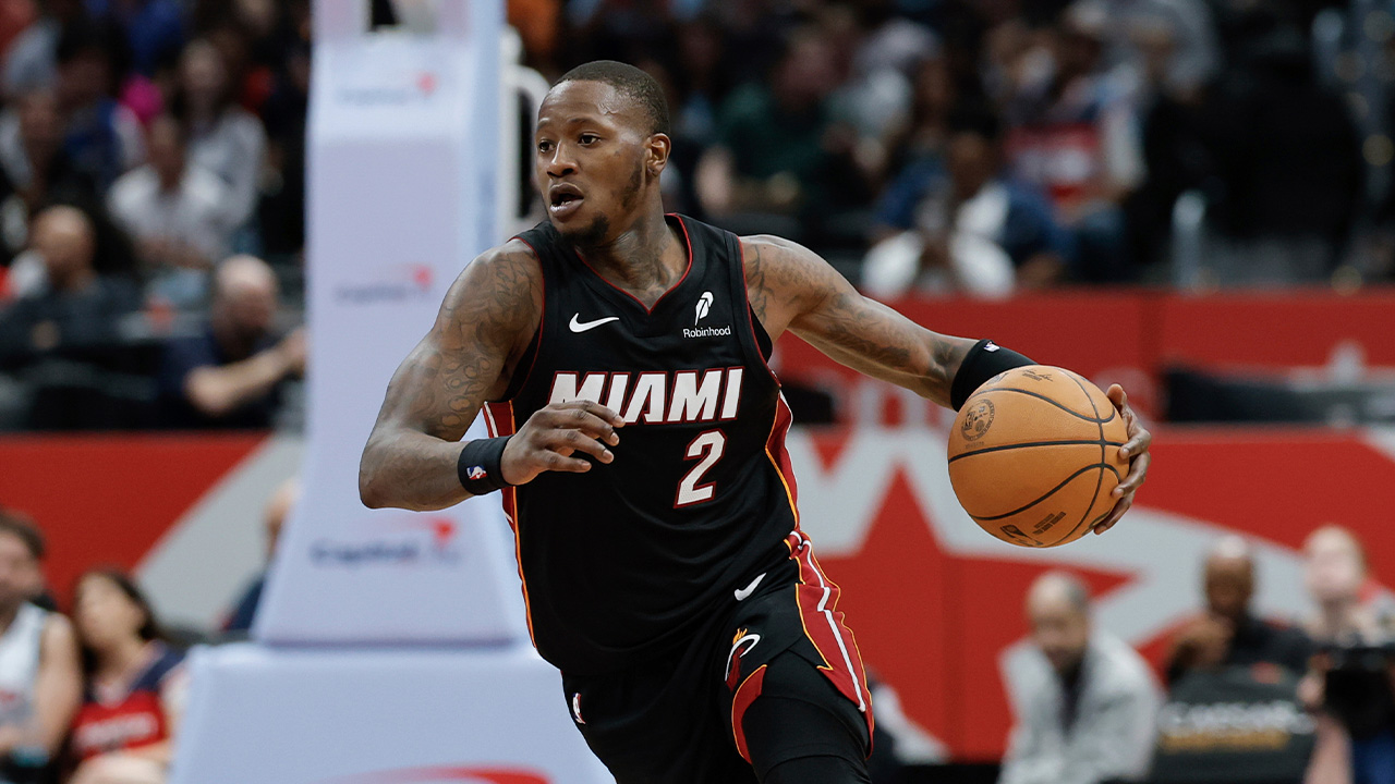 Miami Heat guard Terry Rozier (2) brings the ball up court during the second half of an NBA basketball game against the Washington Wizards in Washington, Monday, March 31, 2025.