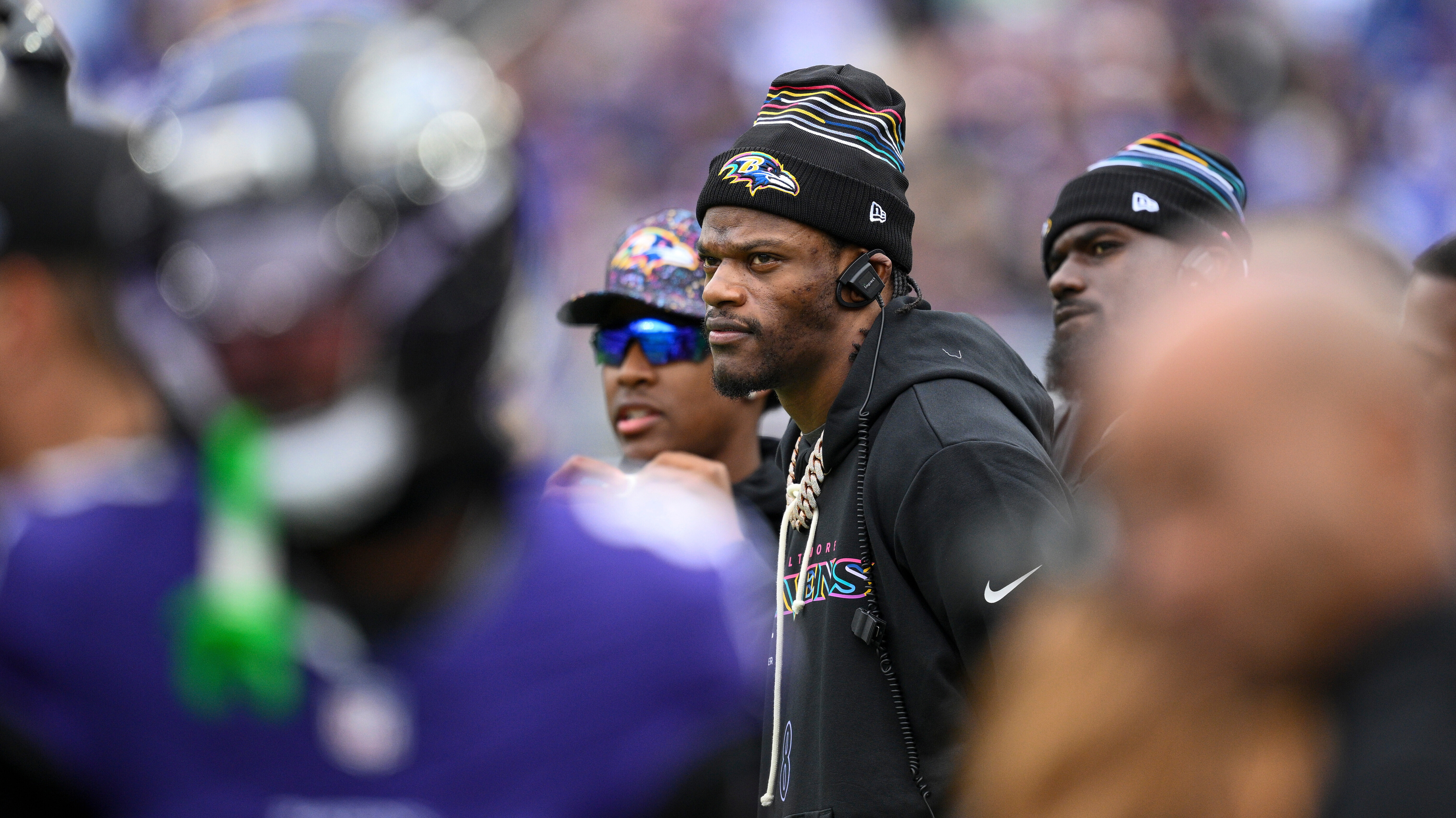 Baltimore Ravens quarterback Lamar Jackson looks on from the sidelines during an NFL football game against the Los Angeles Rams Sunday, Oct. 12, 2025, in Baltimore.