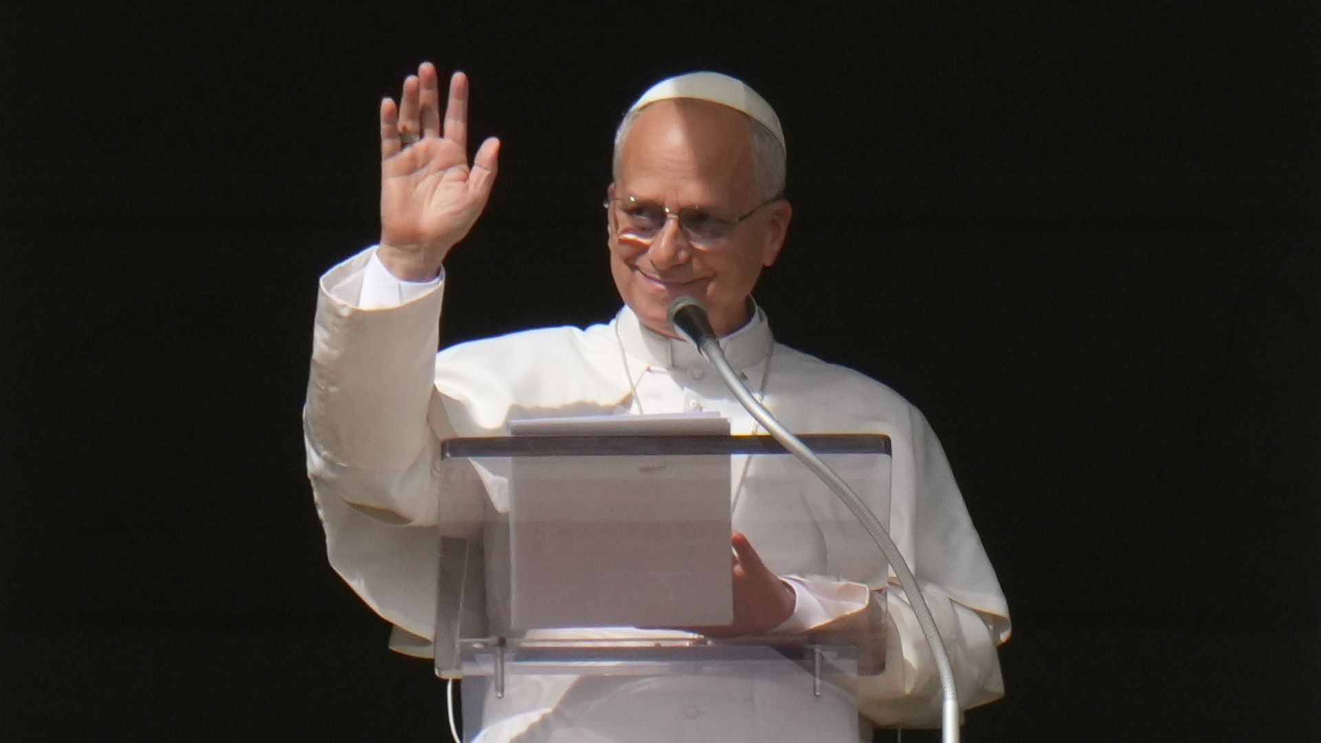 Pope Leo XIV delivers his blessing as he recites the Angelus noon prayer from the window of his studio overlooking St.Peter's Square, at the Vatican, Sunday, Oct. 26, 2025.