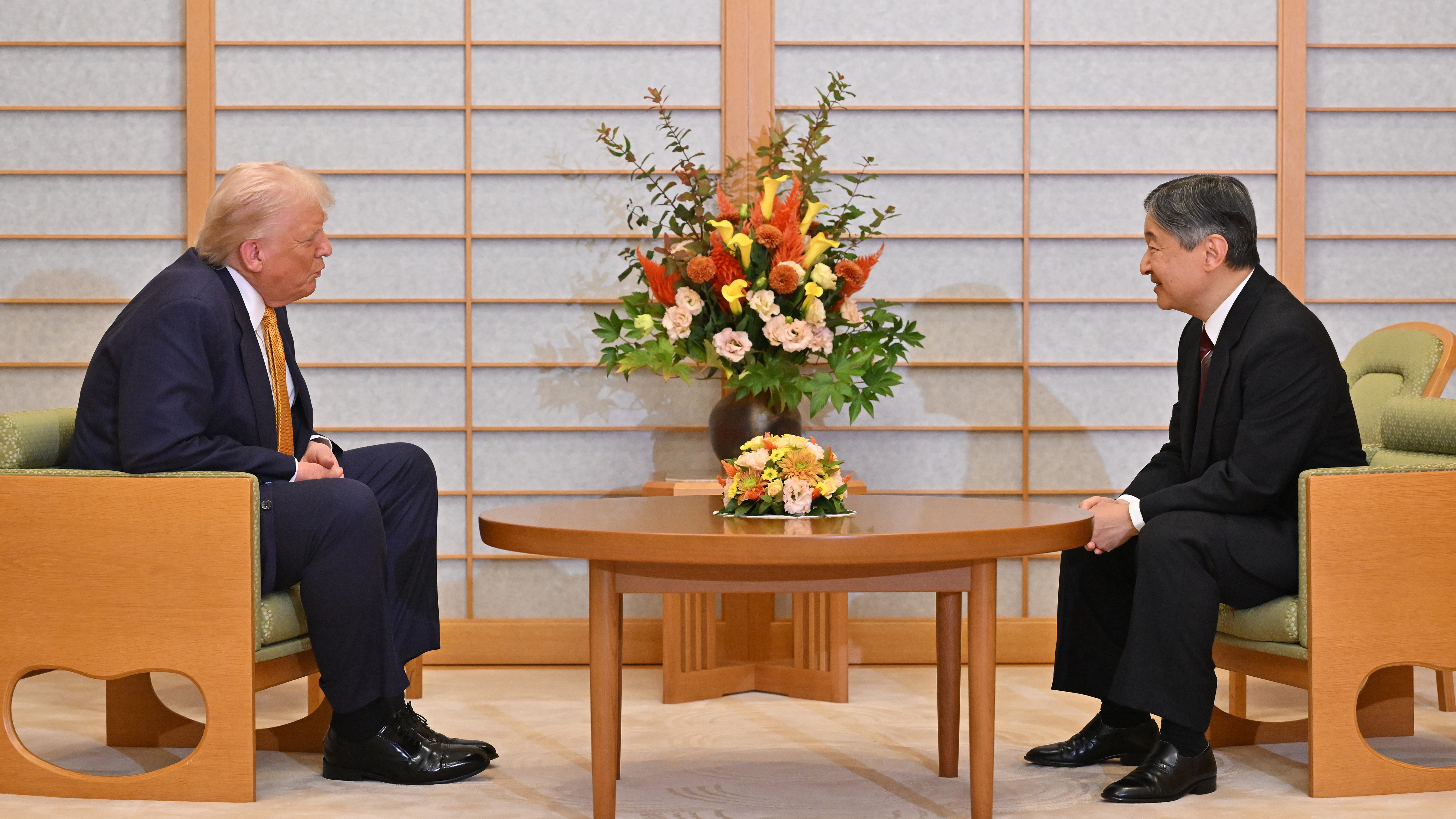 President Donald Trump, left, and Japan's Emperor Naruhito talk during their meeting at the Imperial Palace in Tokyo, Oct. 27, 2025.