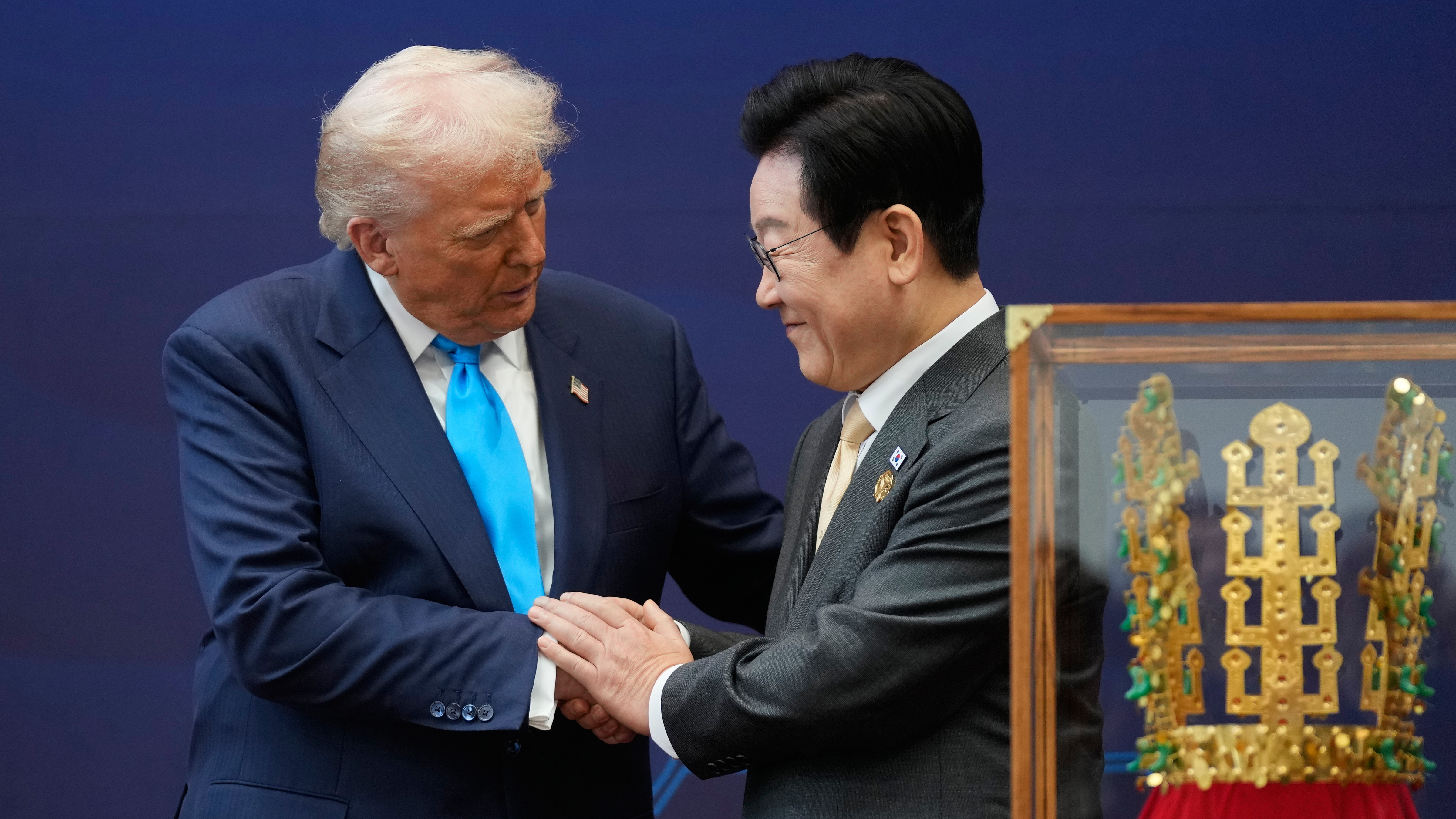President Donald Trump shakes hands with South Korean President Lee Jae Myung as they attend a high honor ceremony at the Gyeongju National Museum in Gyoeongju, South Korea, Wednesday, Oct. 29, 2025.