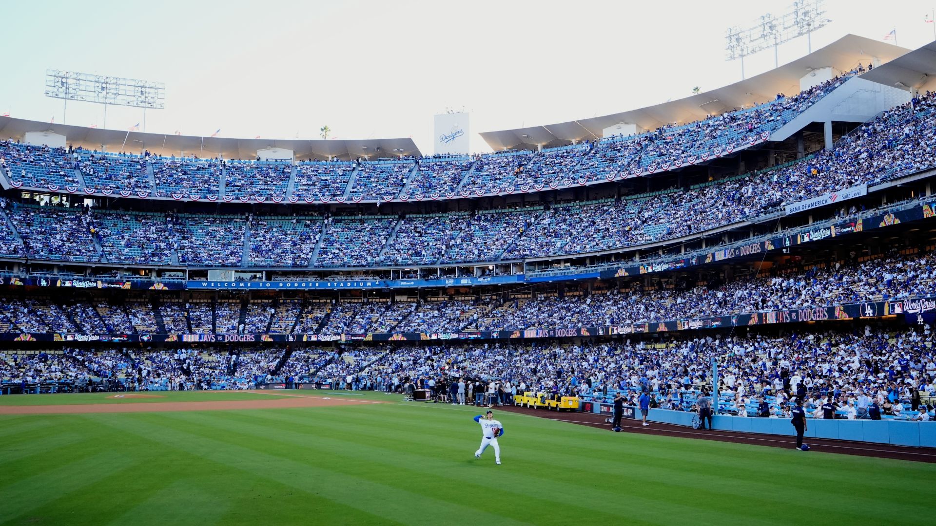 Los Angeles Dodgers pitcher Shohei Ohtani warms up in the outfield before Game 4 of baseball's World Series against the Toronto Blue Jays, Tuesday, Oct. 28, 2025, in Los Angeles.