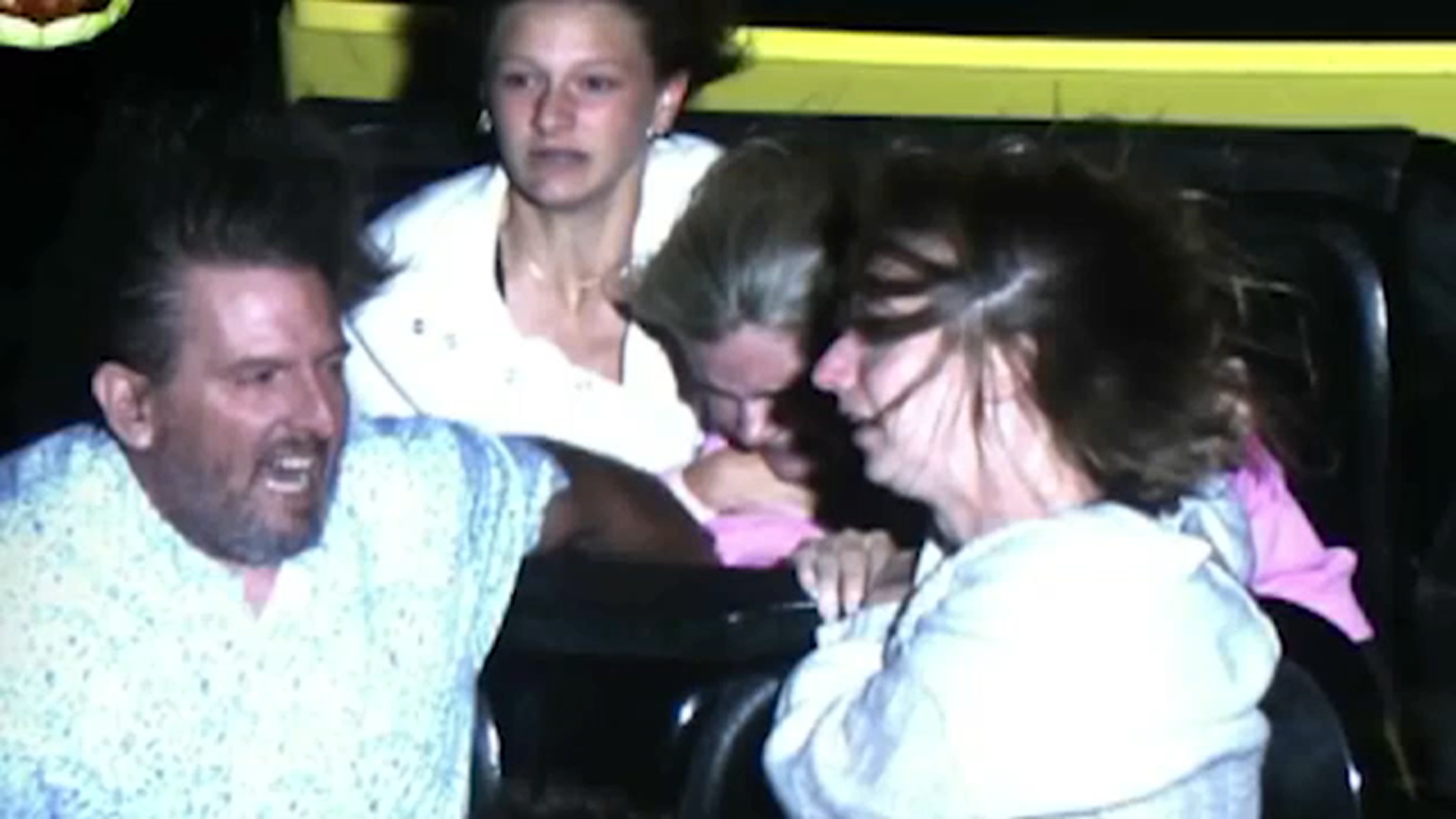 Couple help secure girls on roller coaster after alleged malfunction
