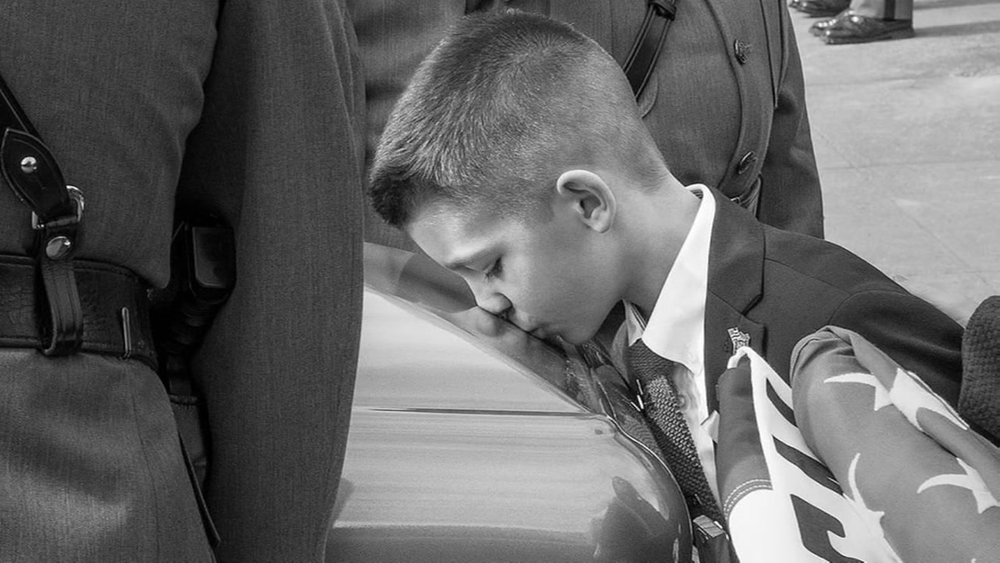 Photo of boy kissing father's casket goes viral