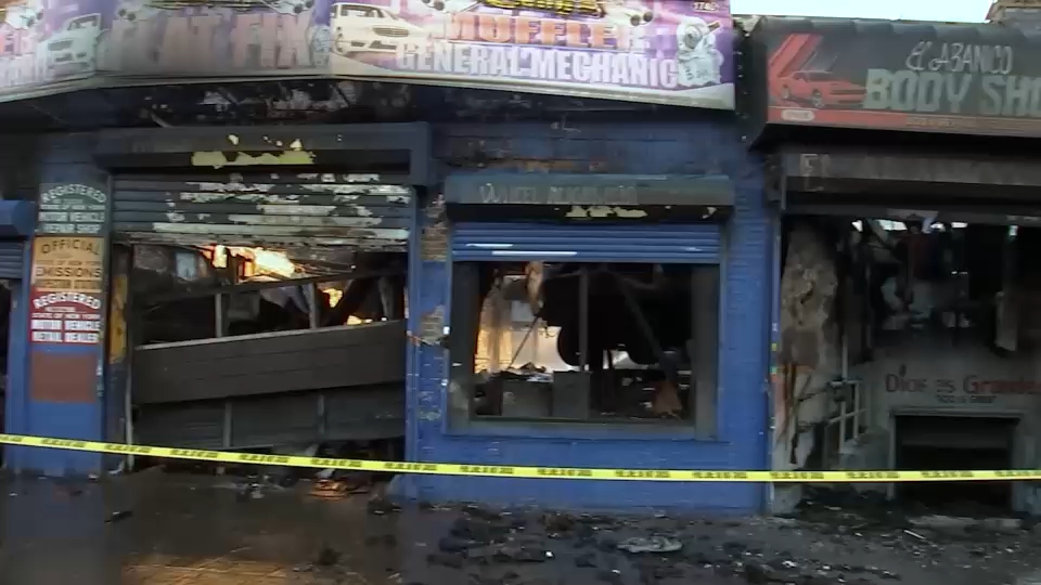 5-alarm fire at autobody shop displaces 16, injures 4 firefighters