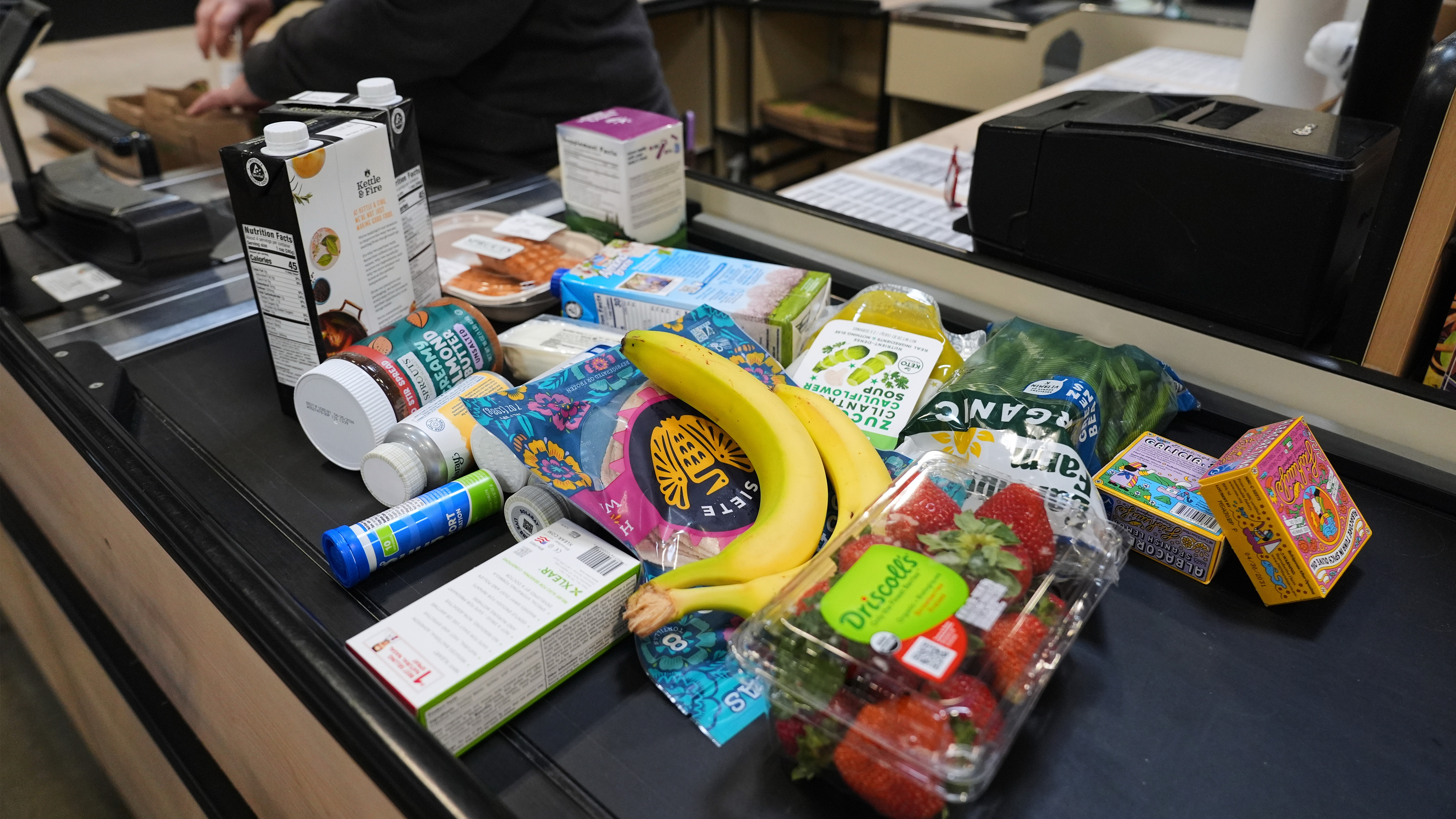 A cashier scans groceries, including produce, which is covered by the USDA Supplemental Nutrition Assistance Program (SNAP), at a grocery store in Baltimore, Monday, Nov. 10, 2025. 