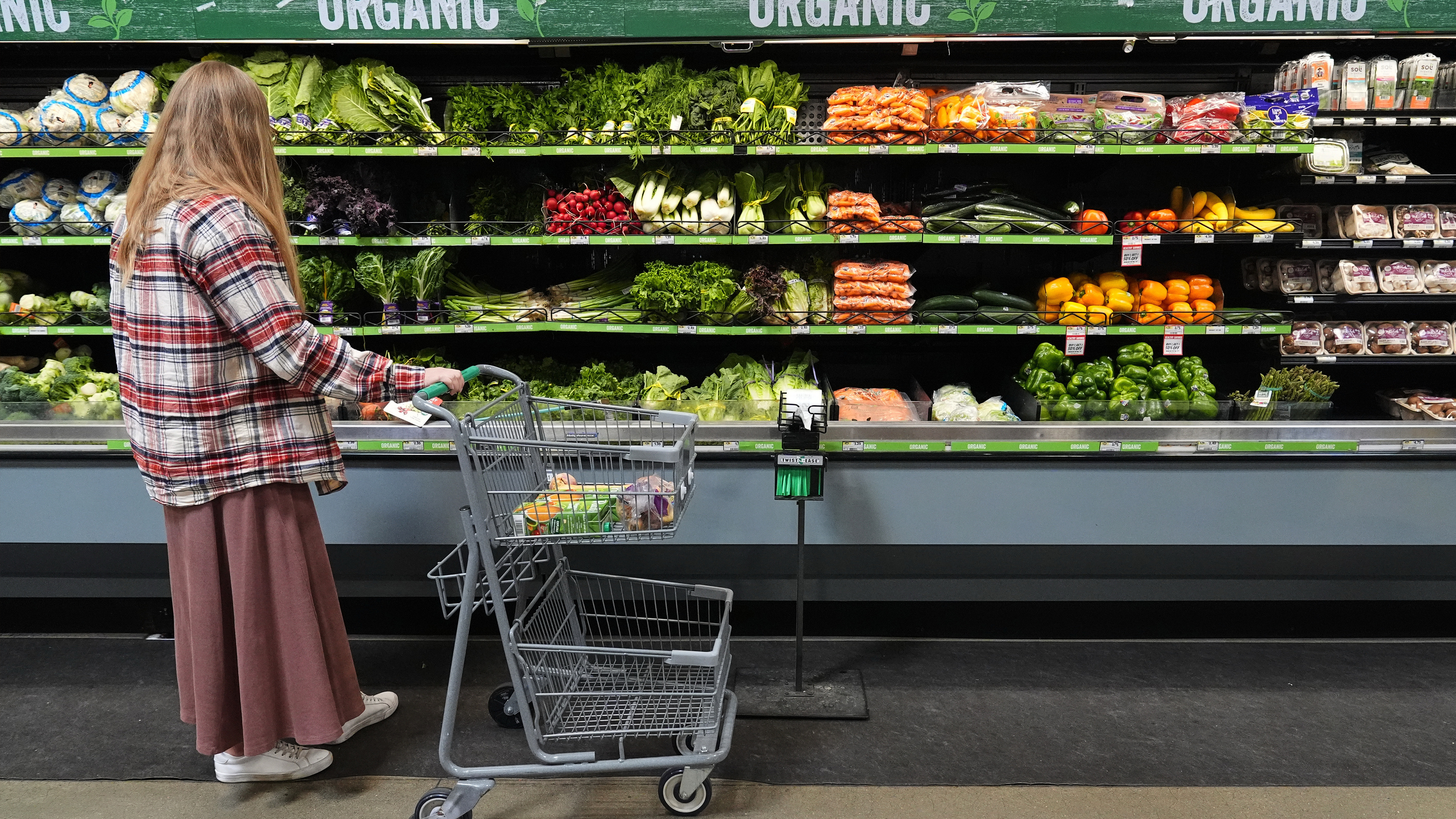 A person shops for produce, which is covered by the USDA Supplemental Nutrition Assistance Program (SNAP), at a grocery store in Baltimore, Monday, Nov. 10, 2025.