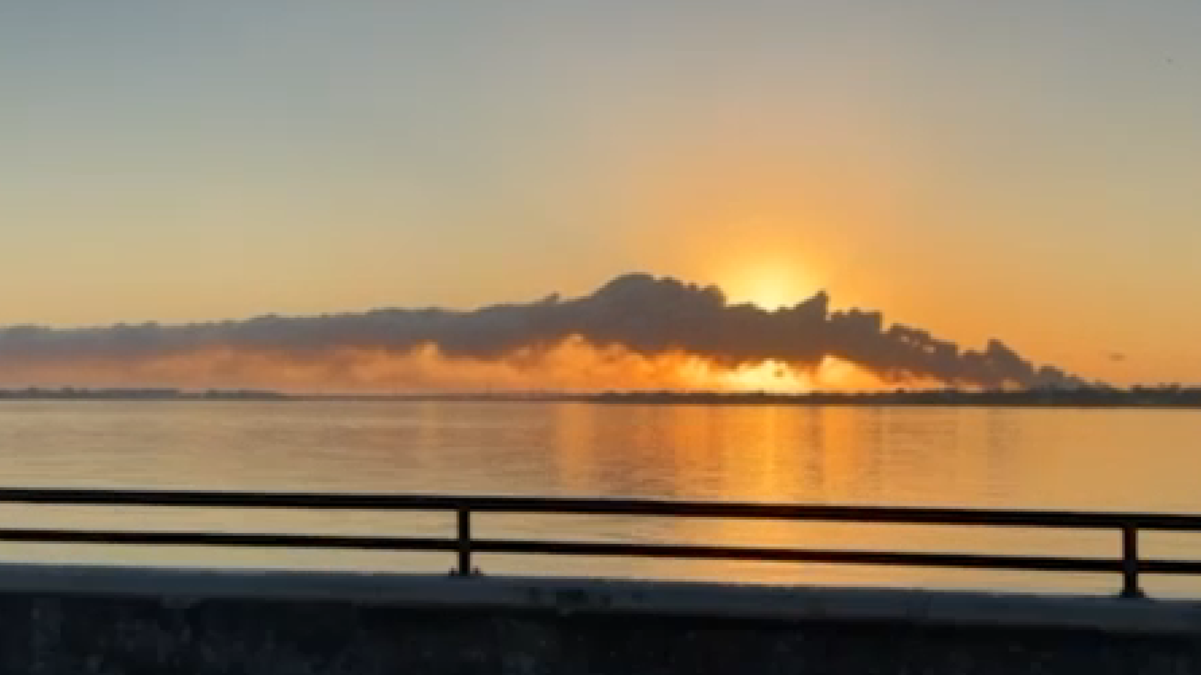 Images captured by an ABC13 crew from Highway 146 show the smoke plume rising over the Texas City sky and blocking the sun during a massive structure fire.