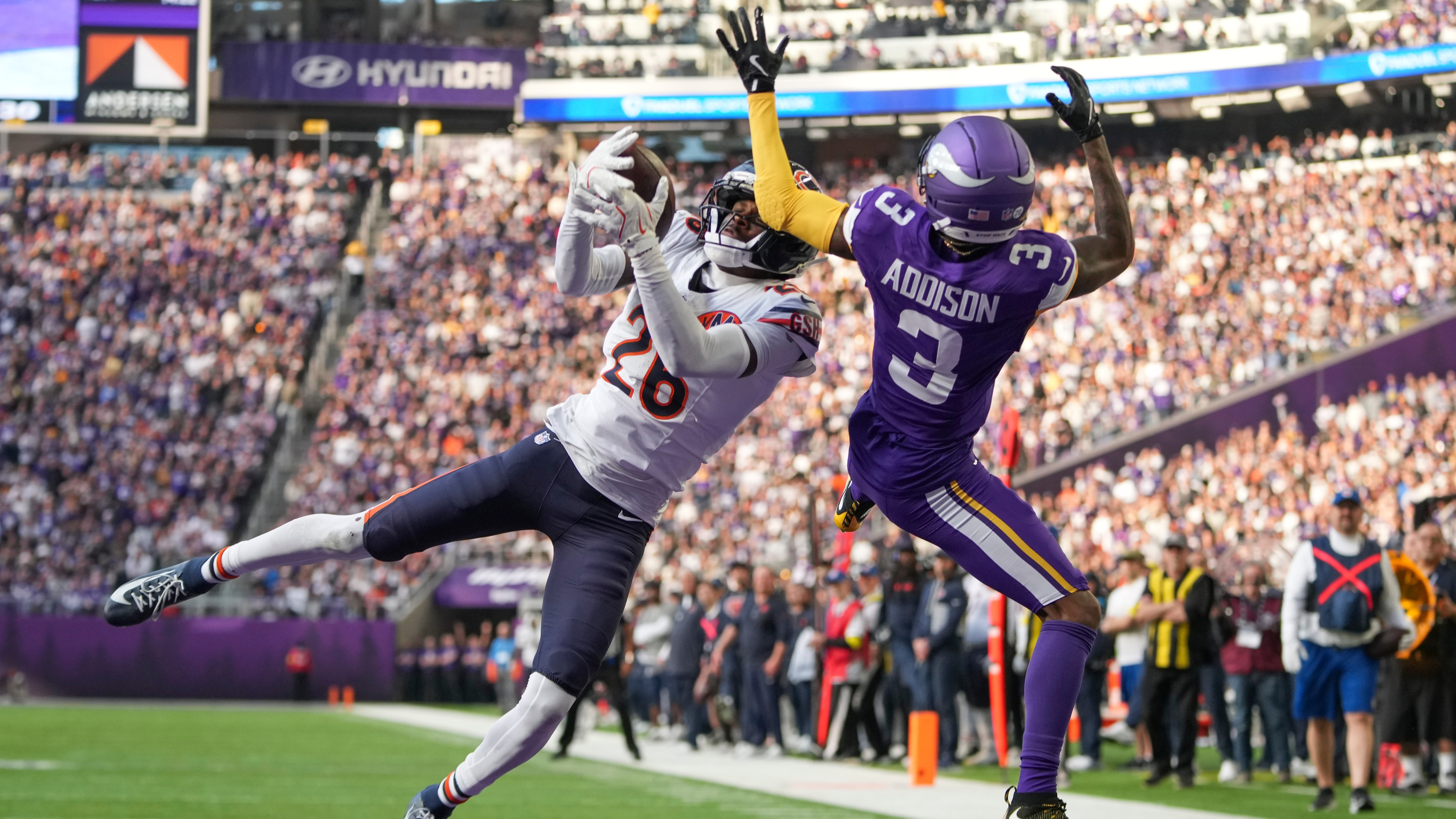 Chicago Bears cornerback Nahshon Wright intercepts a pass intended for Minnesota Vikings wide receiver Jordan Addison during a football game, Sunday, Nov. 16, 2025, in Minneapolis.
