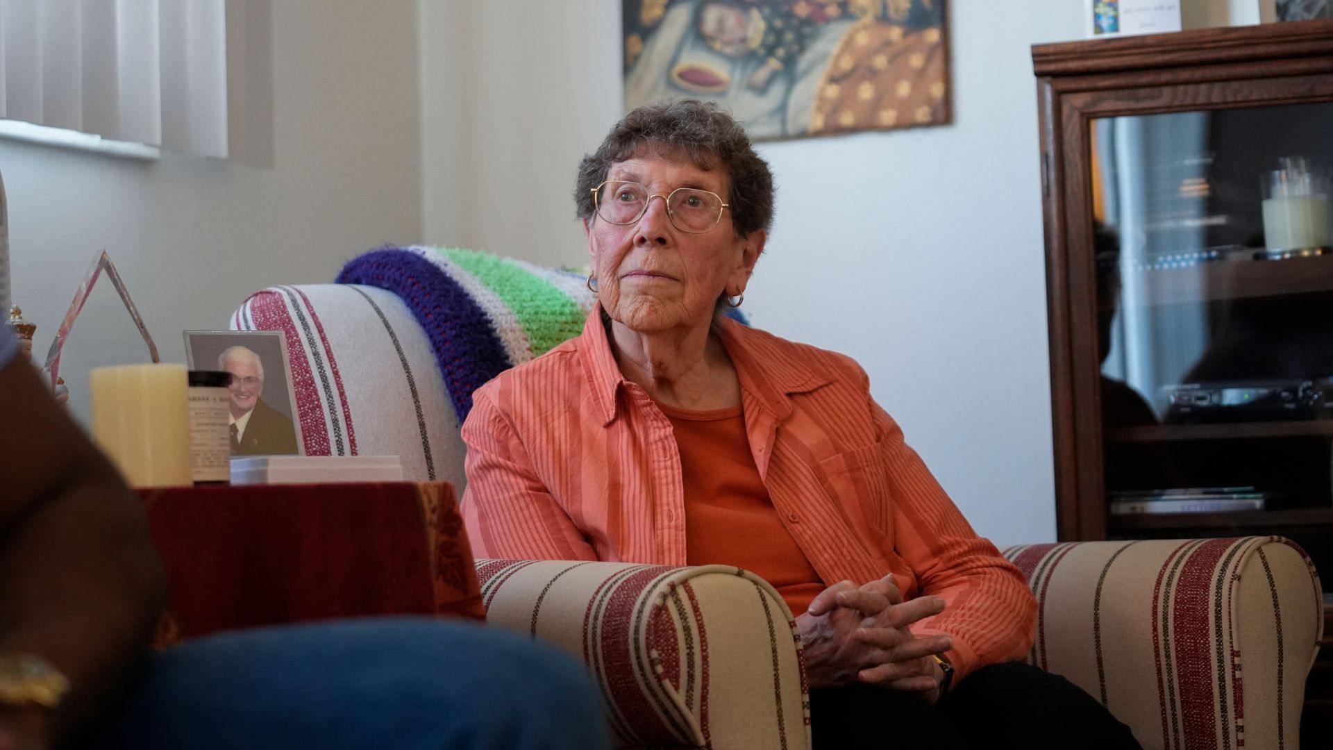 Sister JoAnn Persch, 90, a nun with the Sisters of Mercy, listens to Oscar, an immigrant from Central America seeking asylum, at her home Thursday, Feb. 20, 2025, in Alsip, Ill.