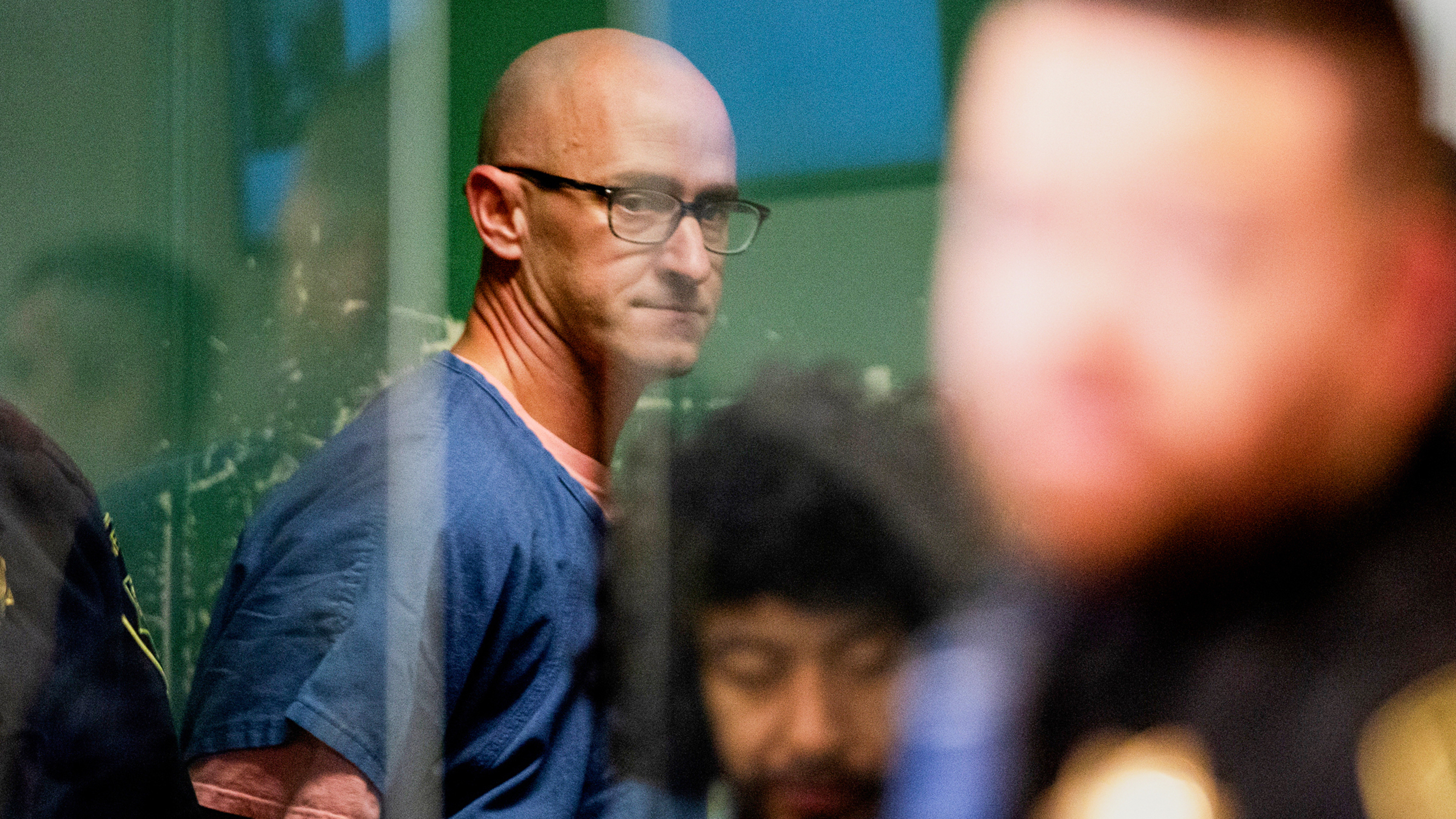 Joseph David Emerson, back, appears in Multnomah County Circuit Court for an indictment hearing in Portland, Ore., on Dec. 7, 2023.