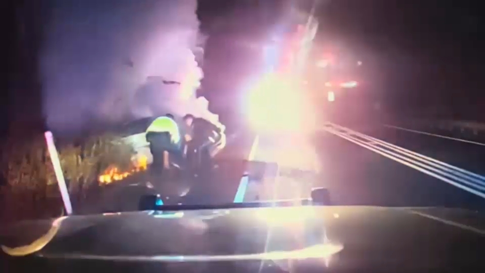 NJ police pull driver from car fire in harrowing rescue