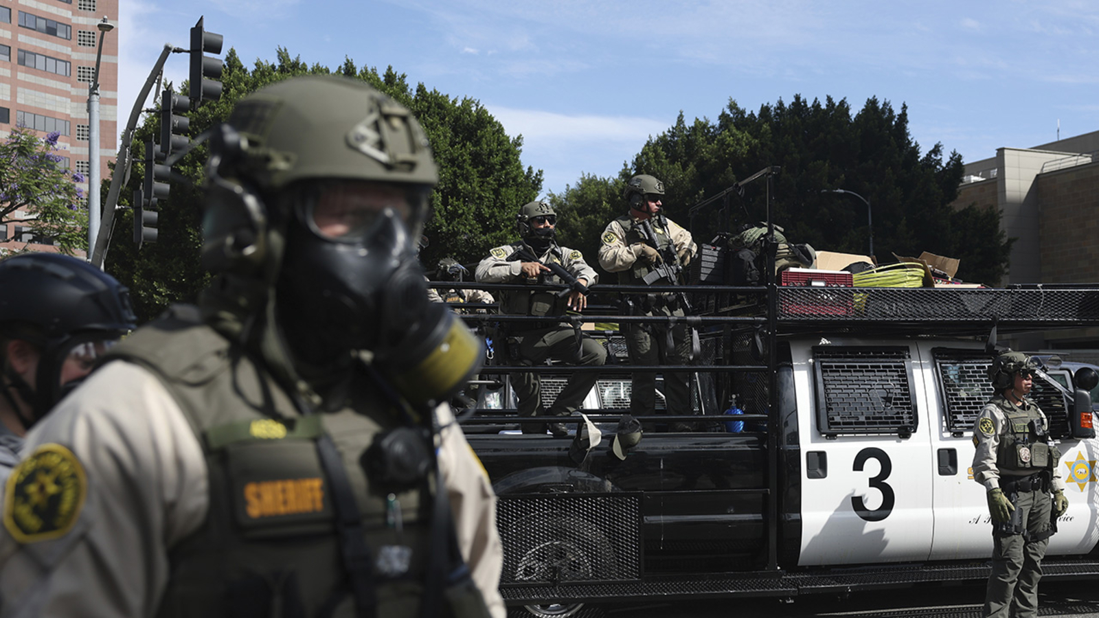 Trump administration sues California over law banning masked federal agents