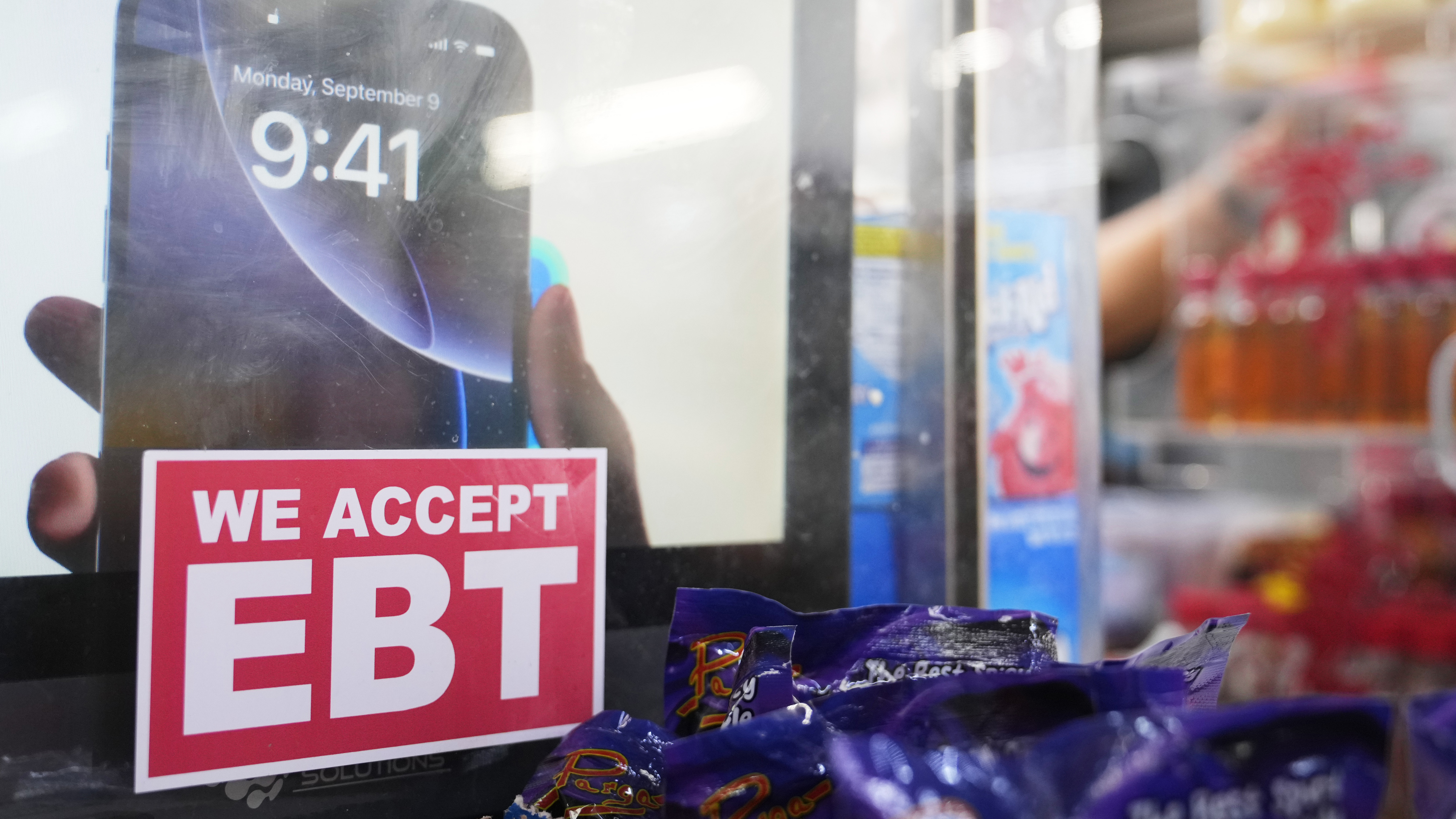 A sign is displayed for EBT for the USDA Supplemental Nutrition Assistance Program (SNAP) at the Friend's Meat Market and Grocery, Friday, Nov. 14, 2025, in Miami.
