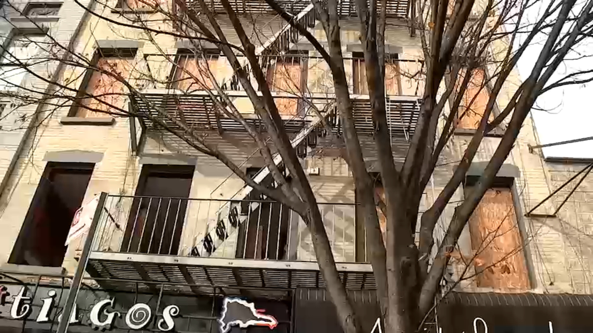 Fire at restaurant beer garden spreads to apartment building; 1 person hurt
