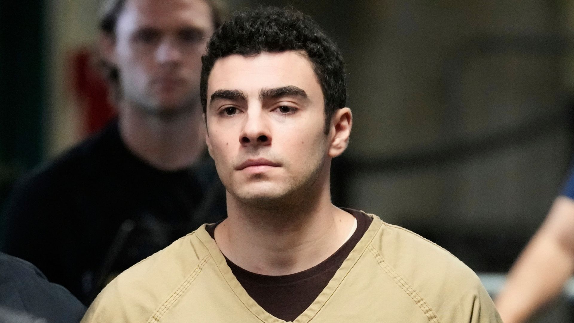 FILE - Luigi Mangione is escorted into Manhattan state court in New York, Sept. 16, 2025.