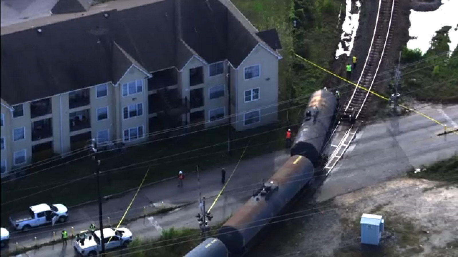 Houston Fire Department responding to train derailment near East End apartment complex