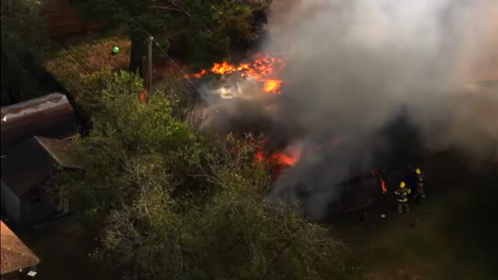 SkyEye shows crews fighting heavy fire burning at home in southeast Houston