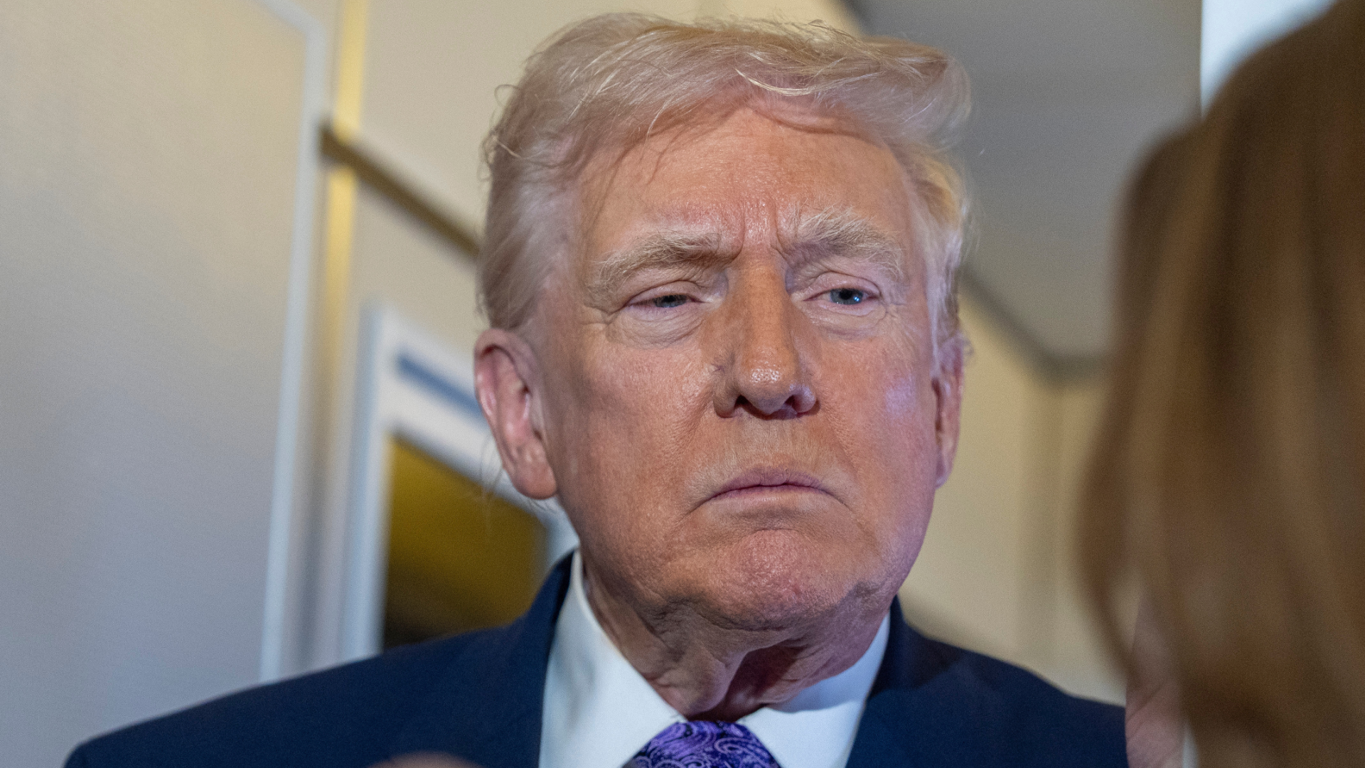 President Donald Trump speaks with reporters while in flight on Air Force One from his Mar-a-Lago estate in Palm Beach, Fla., to Joint Base Andrews, Sunday, Nov. 30, 2025.