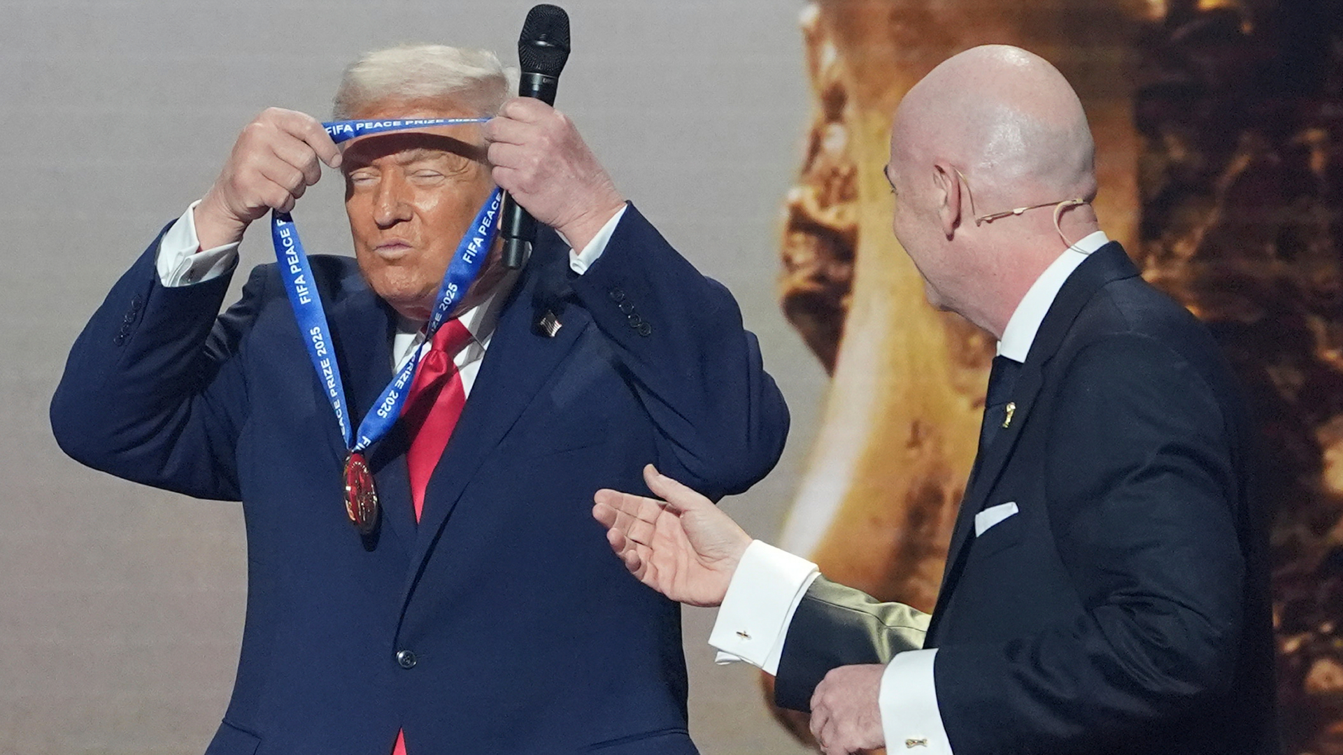 President Donald Trump is presented with the inaugural FIFA Peace Prize by FIFA President Gianni Infantino during the 2026 FIFA World Cup draw at the Kennedy Center, Friday, Dec. 5, 2025, in Washington.