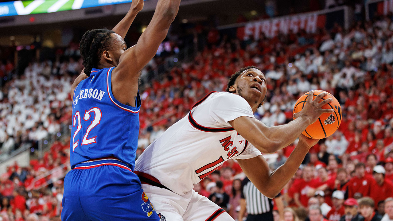 N.C. State's Quadir Copeland looks to shoot as Kansas' Darryn Peterson defends on Saturday in Raleigh.