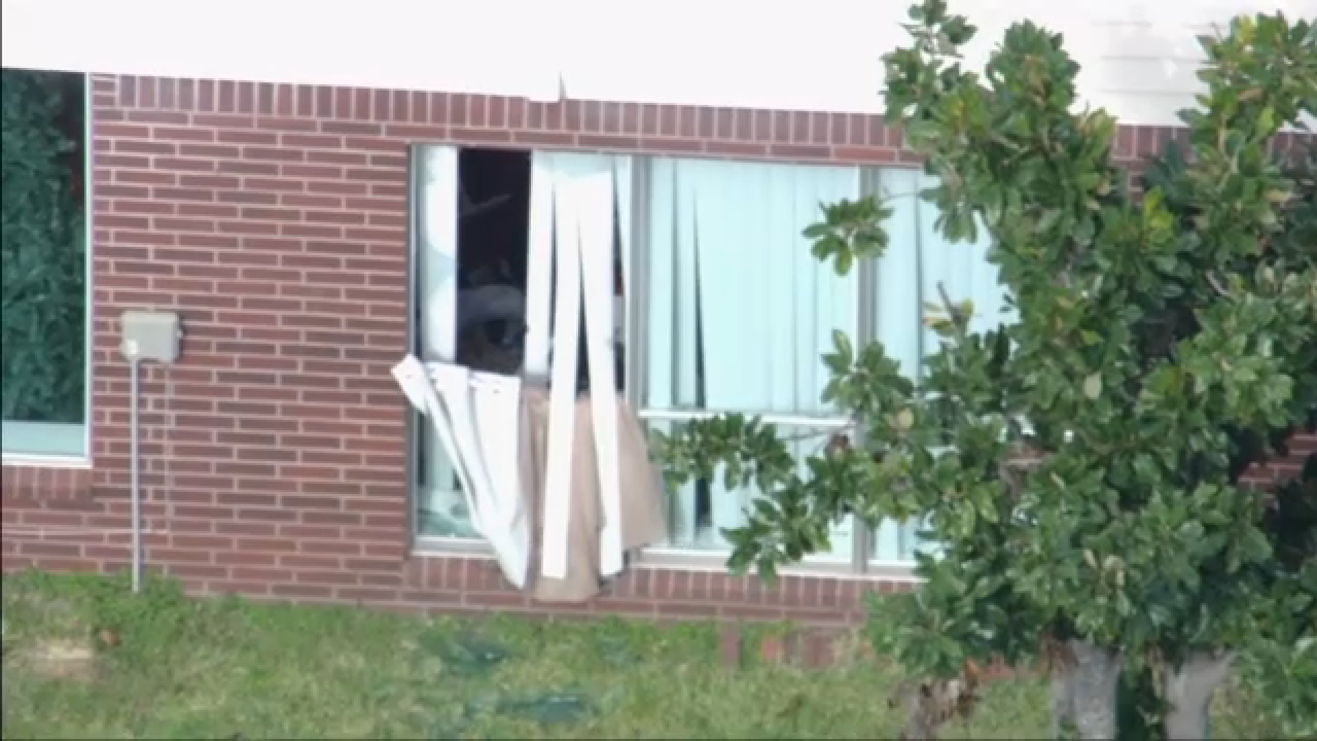 SkyEye images showed law enforcement at the scene and a shattered window at the back of the home.