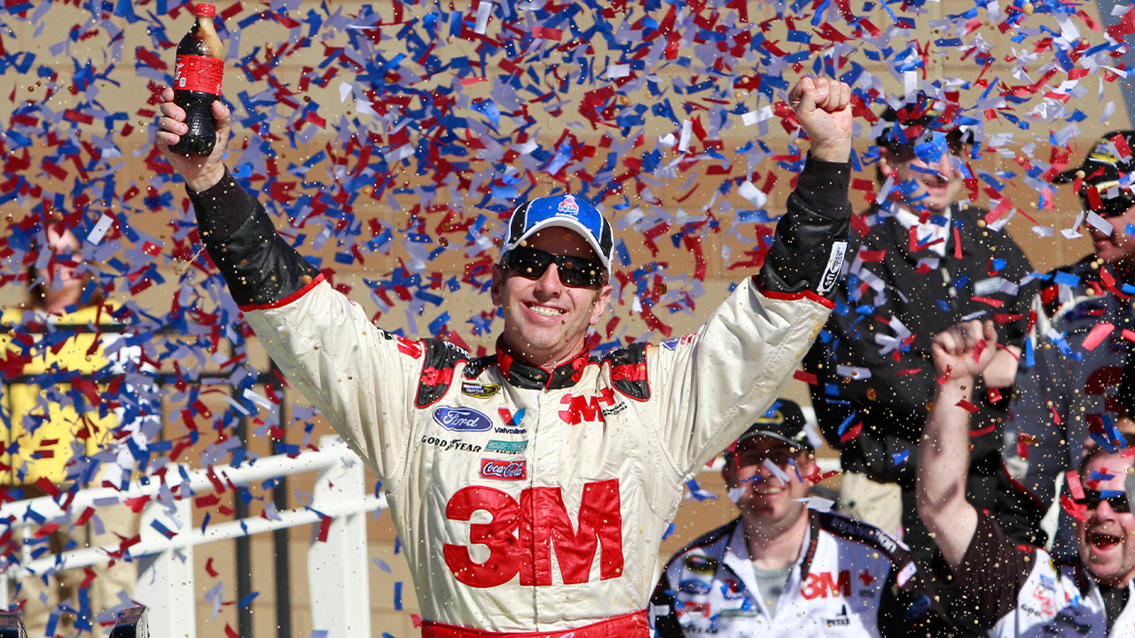 Greg Biffle celebrates in victory lane after winning the NASCAR Sprint Cup Series auto race at Kansas Speedway on Sunday, Oct. 3, 2010, in Kansas City, Kan.