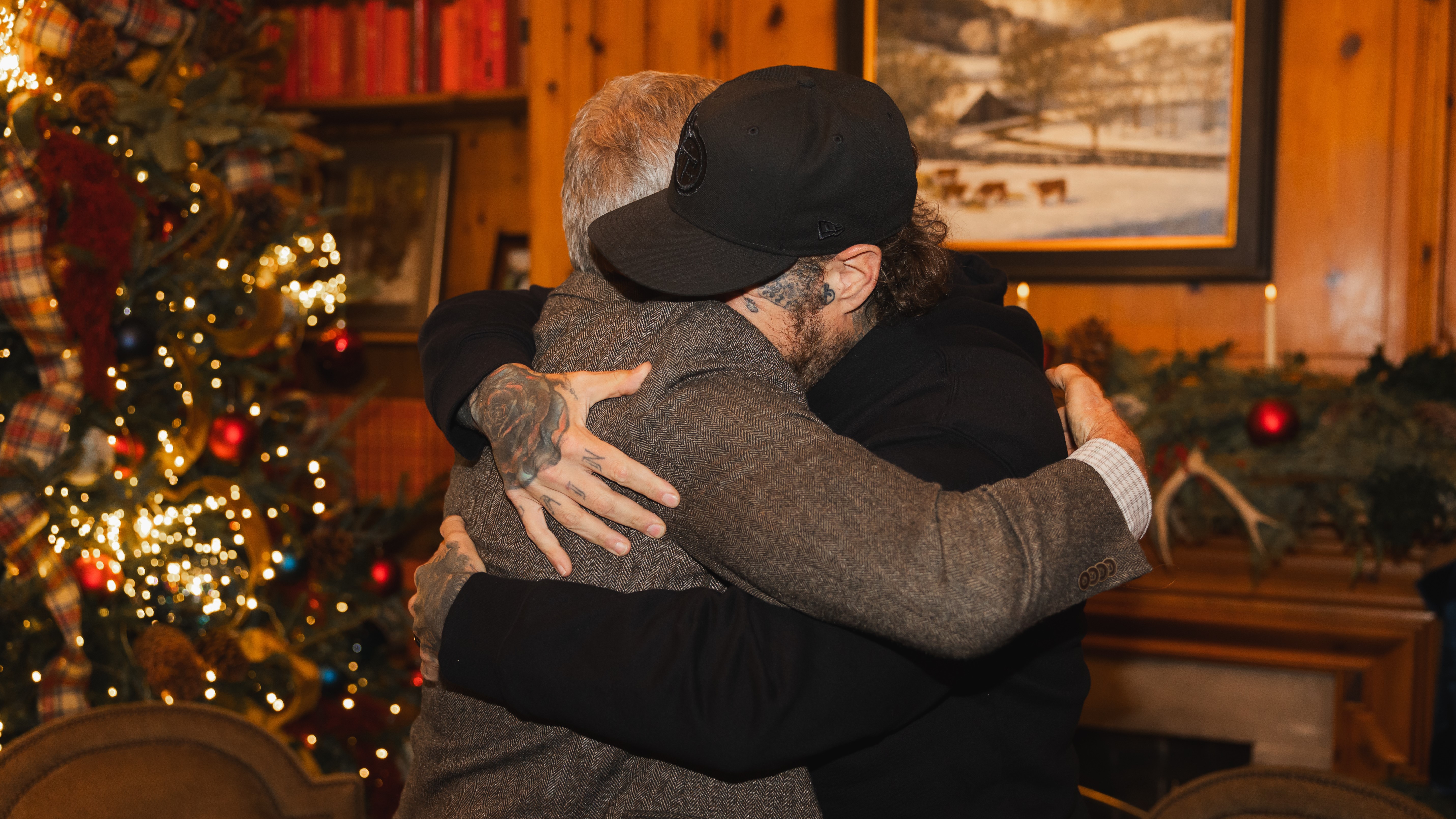 This photo provided by the office of Tennessee Gov. Bill Lee shows Gov. Bill Lee, left, hugs country musician Jelly Roll on Thursday, Dec. 18, 2025.