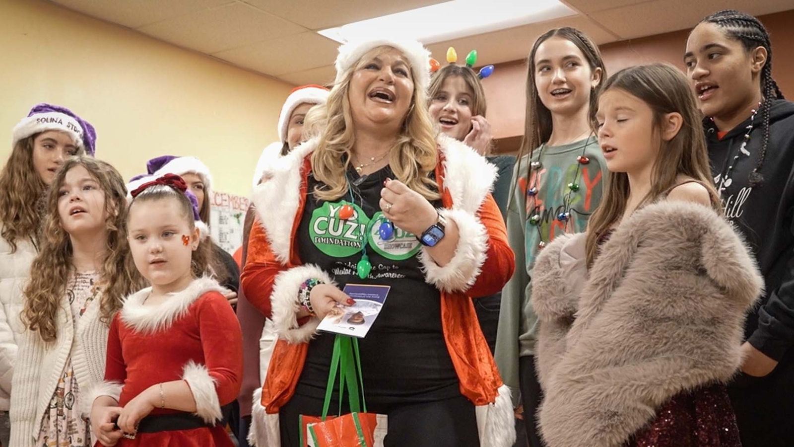 Cancer survivor brings carols and care packages to patients
