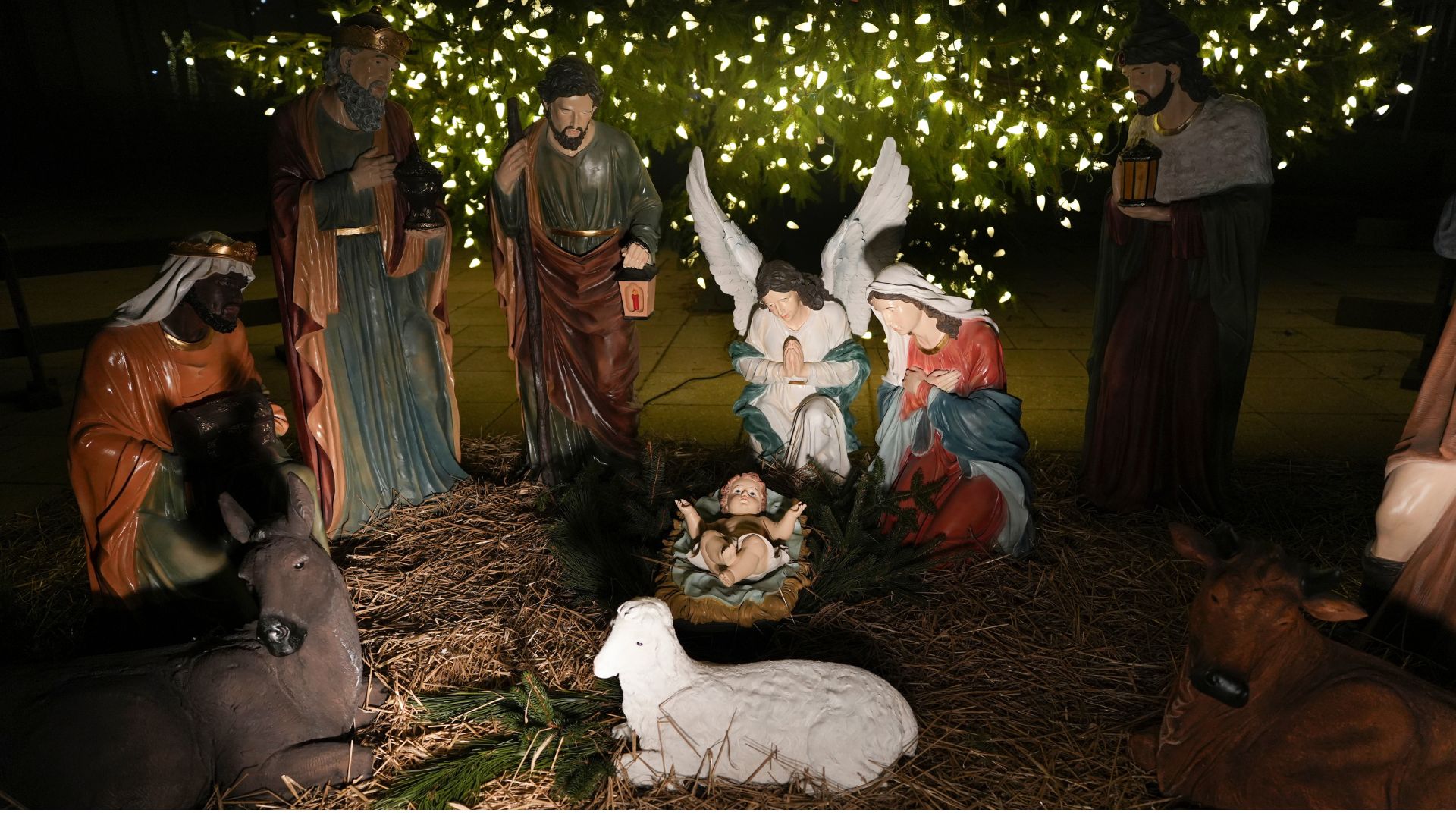 A Nativity scene is illuminated by a Christmas tree on Payrow Plaza in Bethlehem, Pa., known as "Christmas City, USA," on Sunday, Dec. 1, 2024.