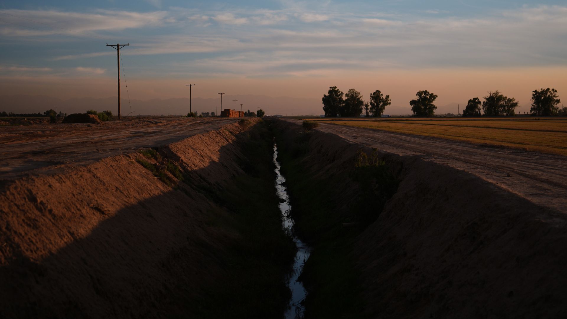 Water sits in a ditch Friday, Dec. 12, 2025, in El Centro, Calif.