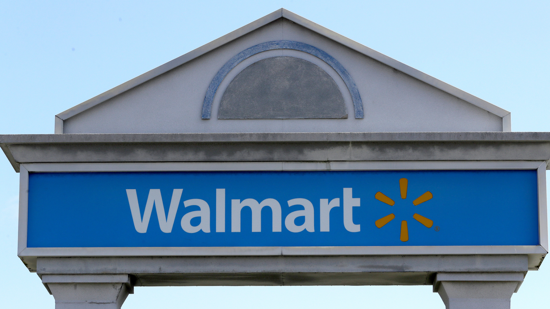 FILE - In this Tuesday, Sept. 3, 2019, file photo, a Walmart logo forms part of a sign outside a Walmart store, in Walpole, Mass.