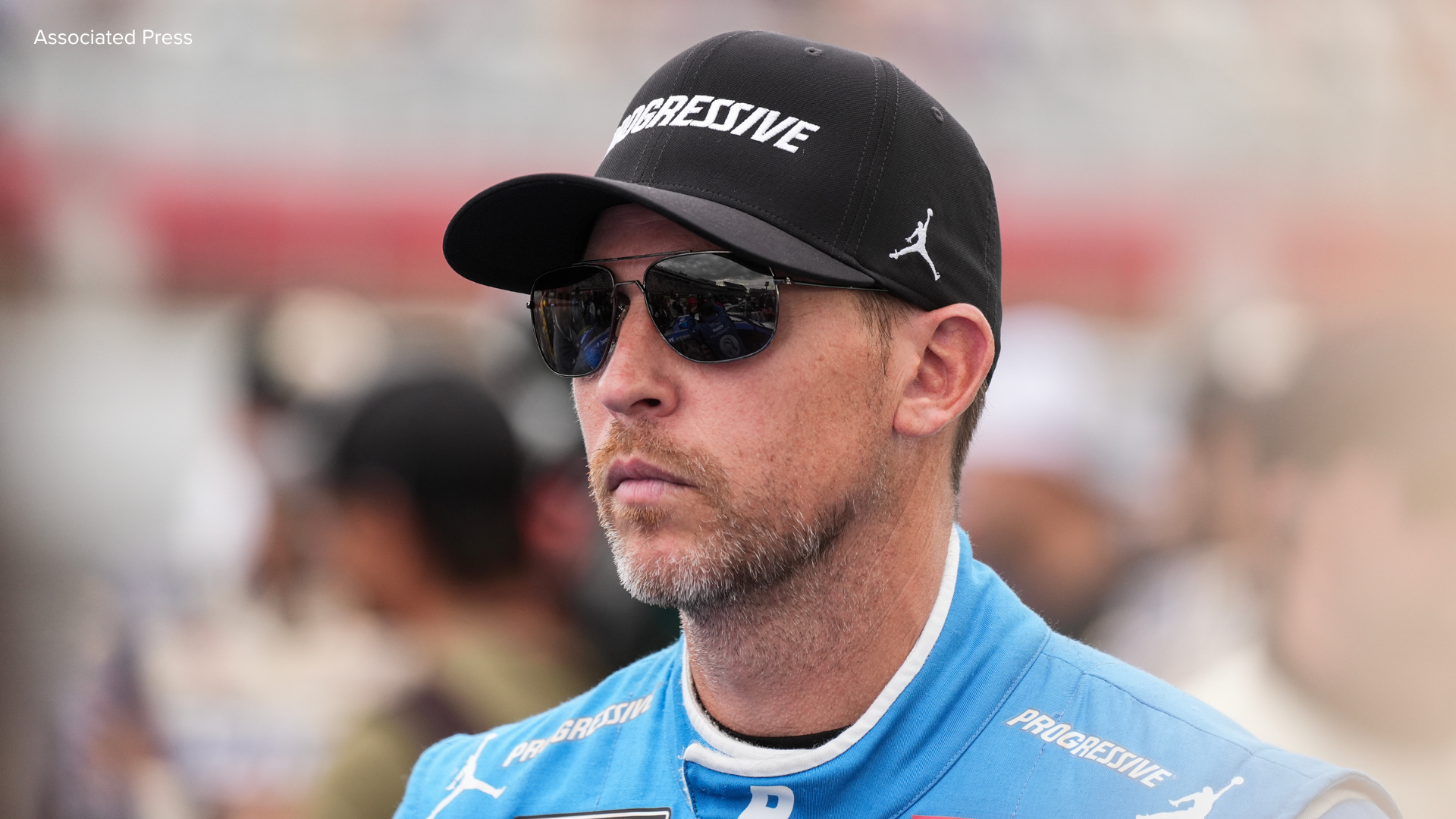 Denny Hamlin looks on prior to a NASCAR Cup Series auto race at Charlotte Motor Speedway, Sunday, Oct. 5, 2025, in Concord, N.C.